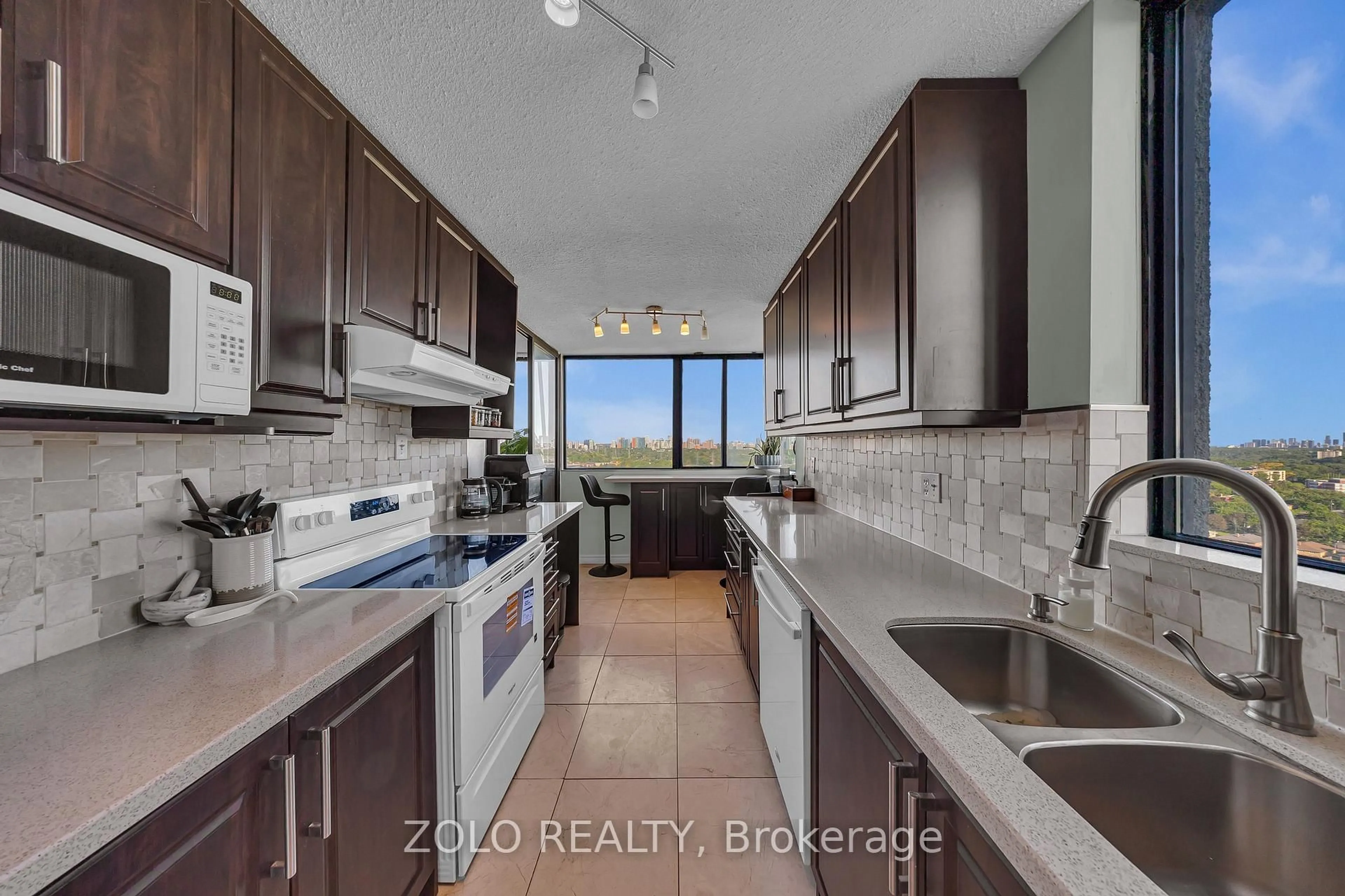 Kitchen with laundary machines, ceramic/tile floor for 133 Torresdale Ave #2502, Toronto Ontario M2R 3T2