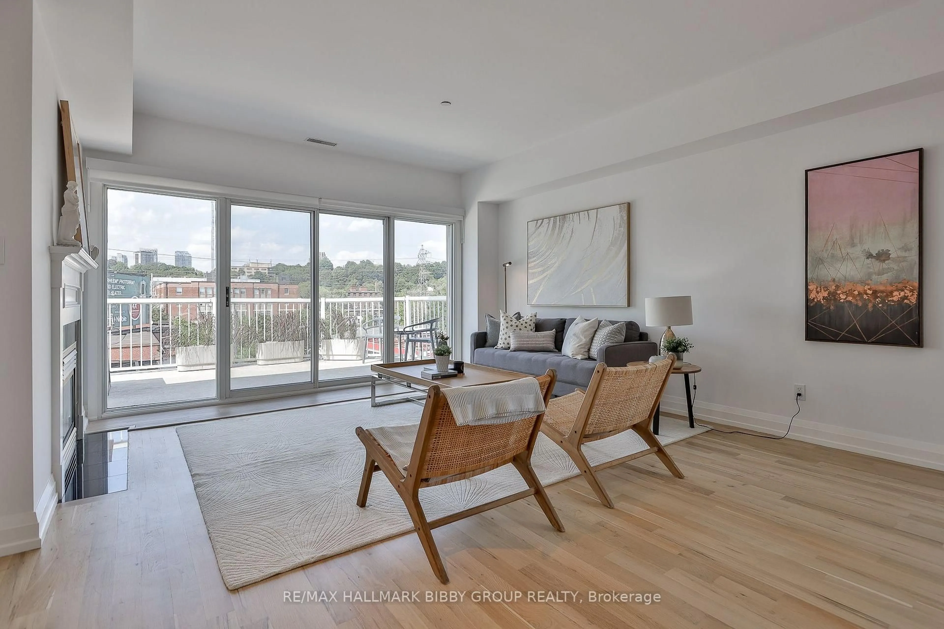 Living room with furniture, wood/laminate floor for 473 Dupont St #7, Toronto Ontario M6G 1Y6