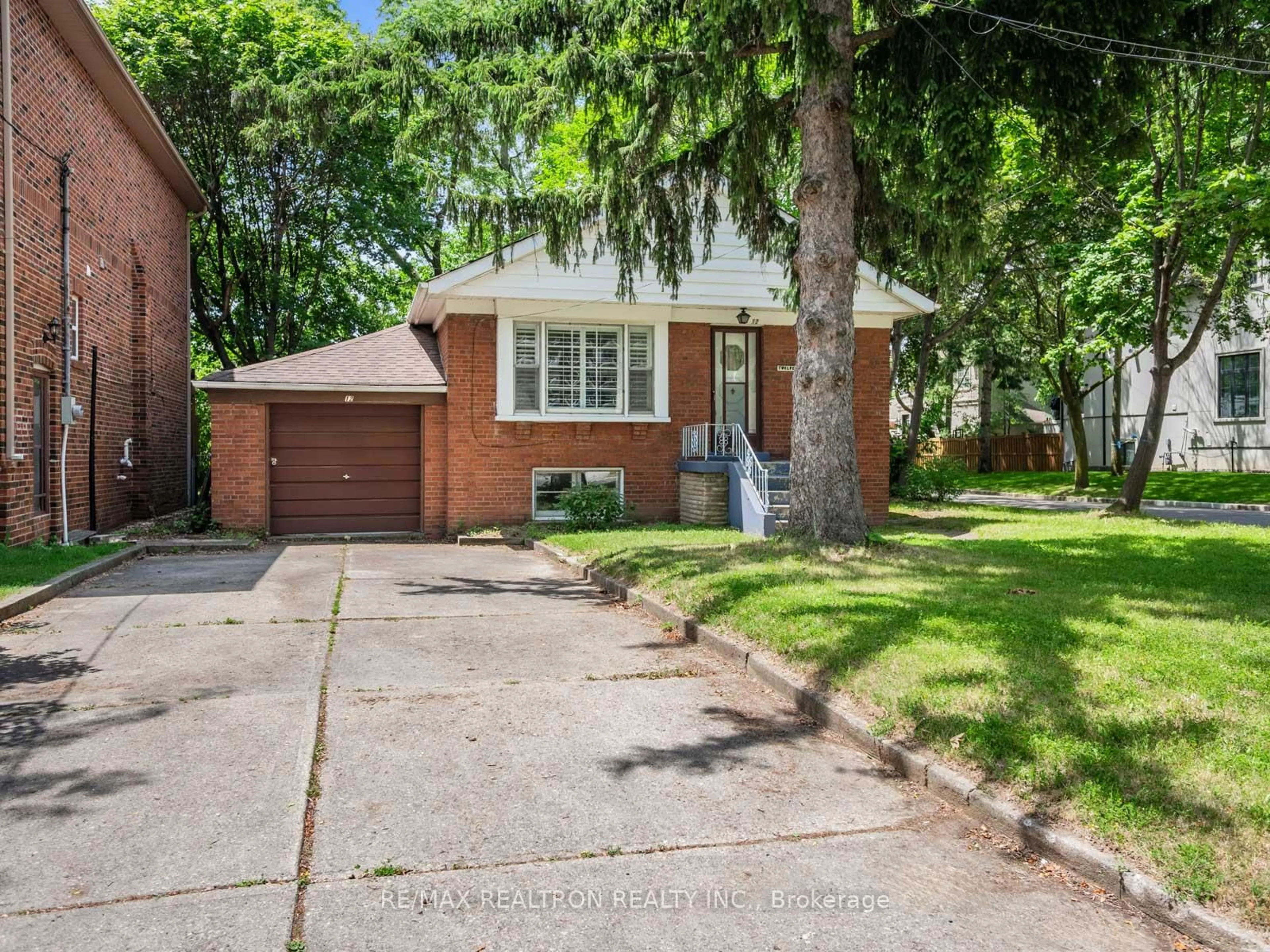 Home with brick exterior material, street for 12 Graymar Ave, Toronto Ontario M3H 3B4