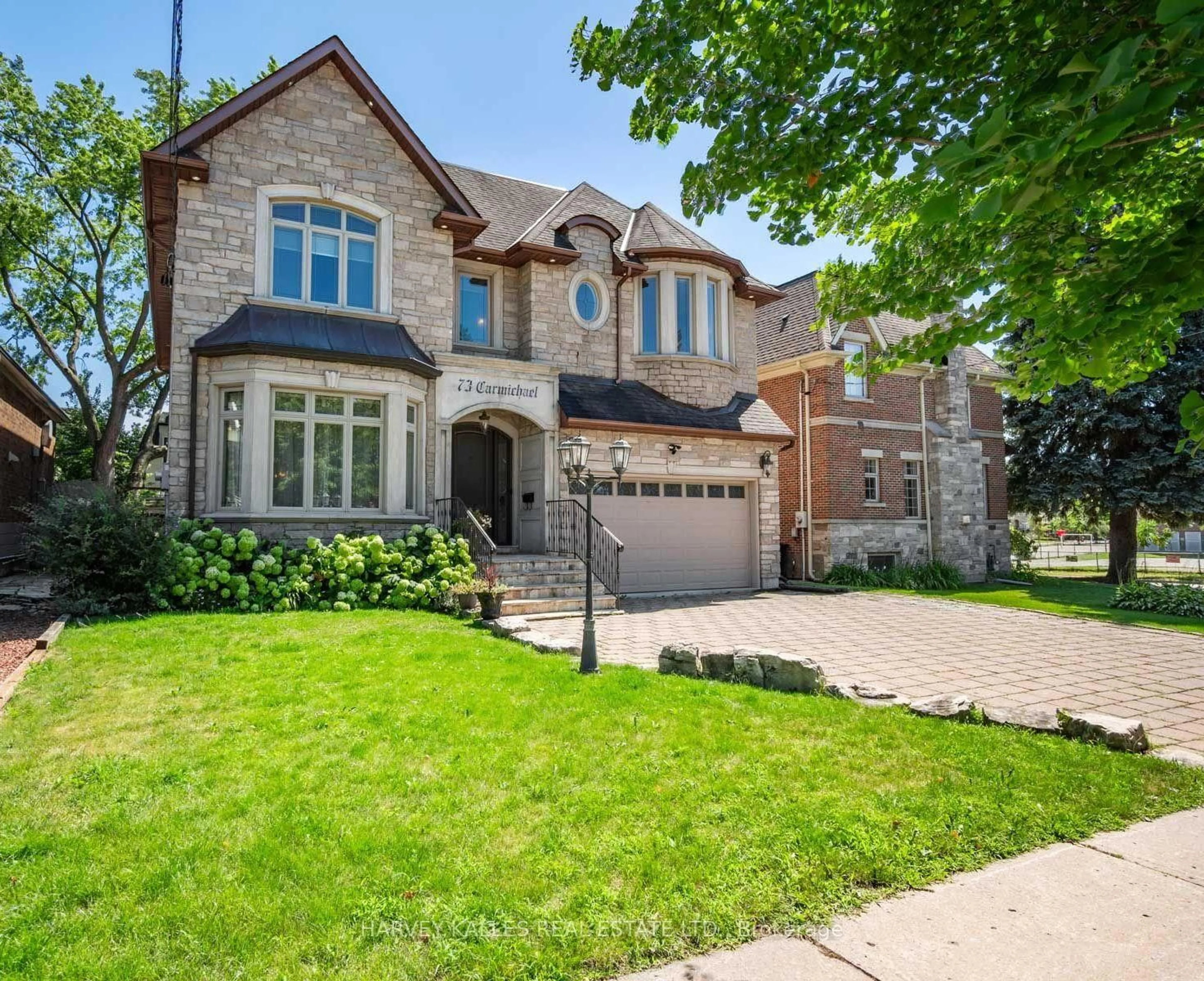 Home with brick exterior material, street for 73 Carmichael Ave, Toronto Ontario M5M 2W8