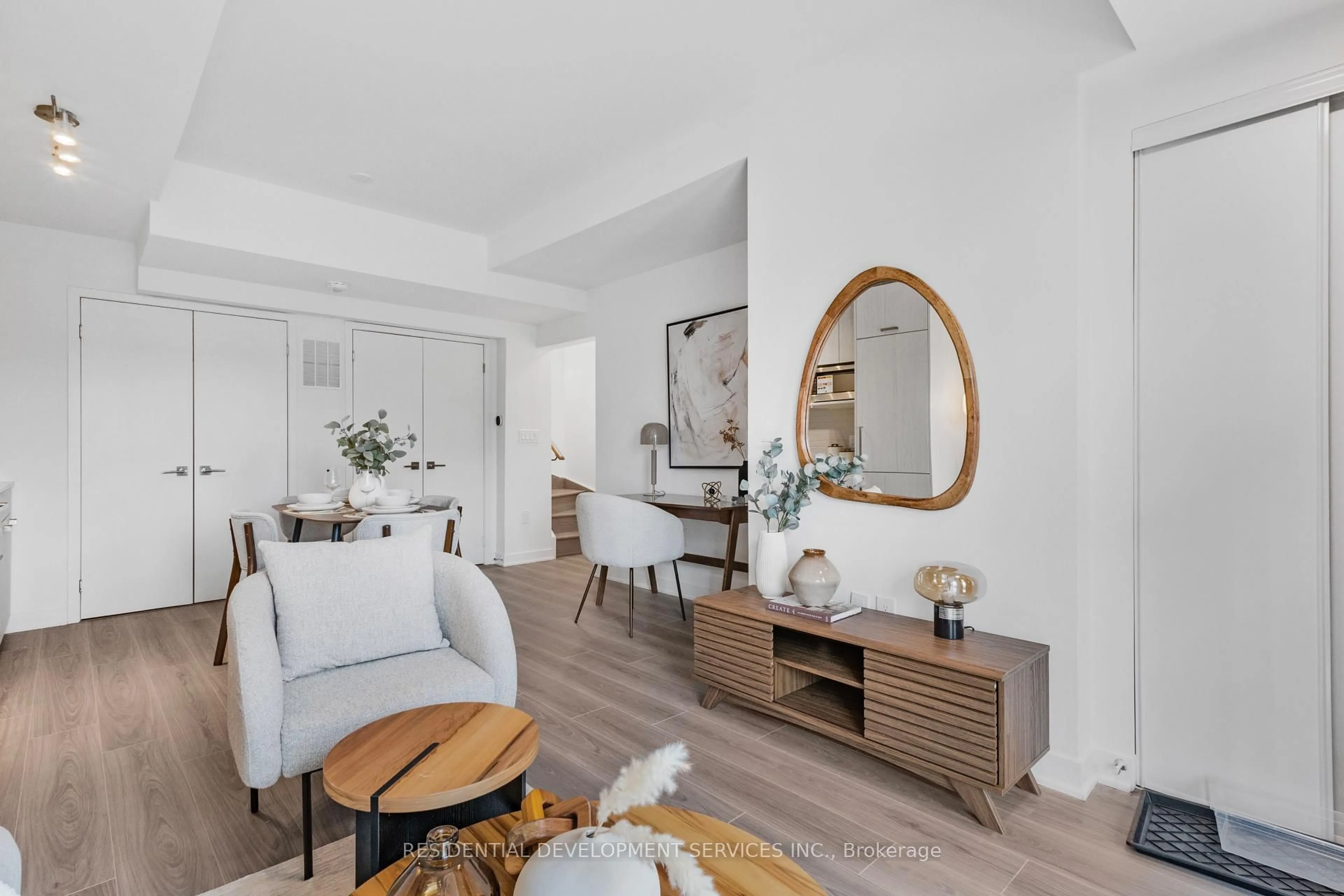 Living room with furniture, wood/laminate floor for 67 Curlew Dr #149, Toronto Ontario M3A 0B4