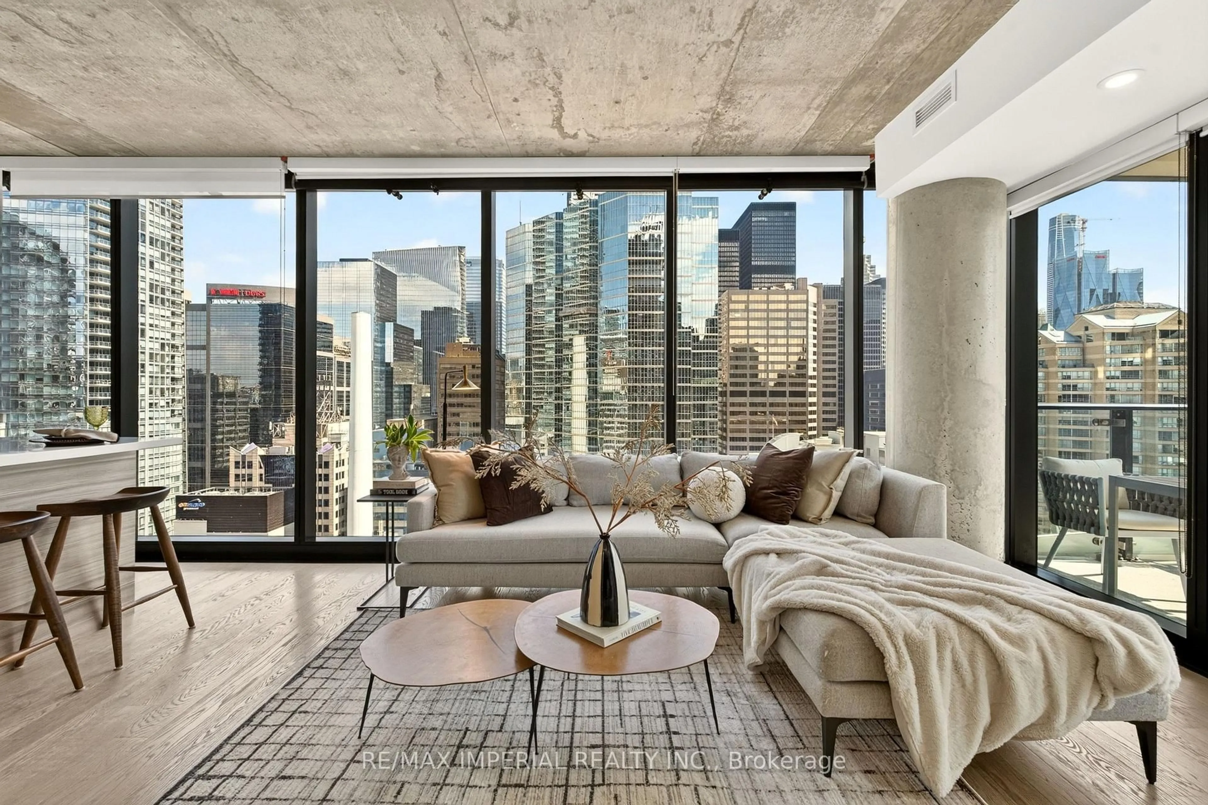 Living room with furniture, cement floor for 224 King St #1804, Toronto Ontario M5H 0A6