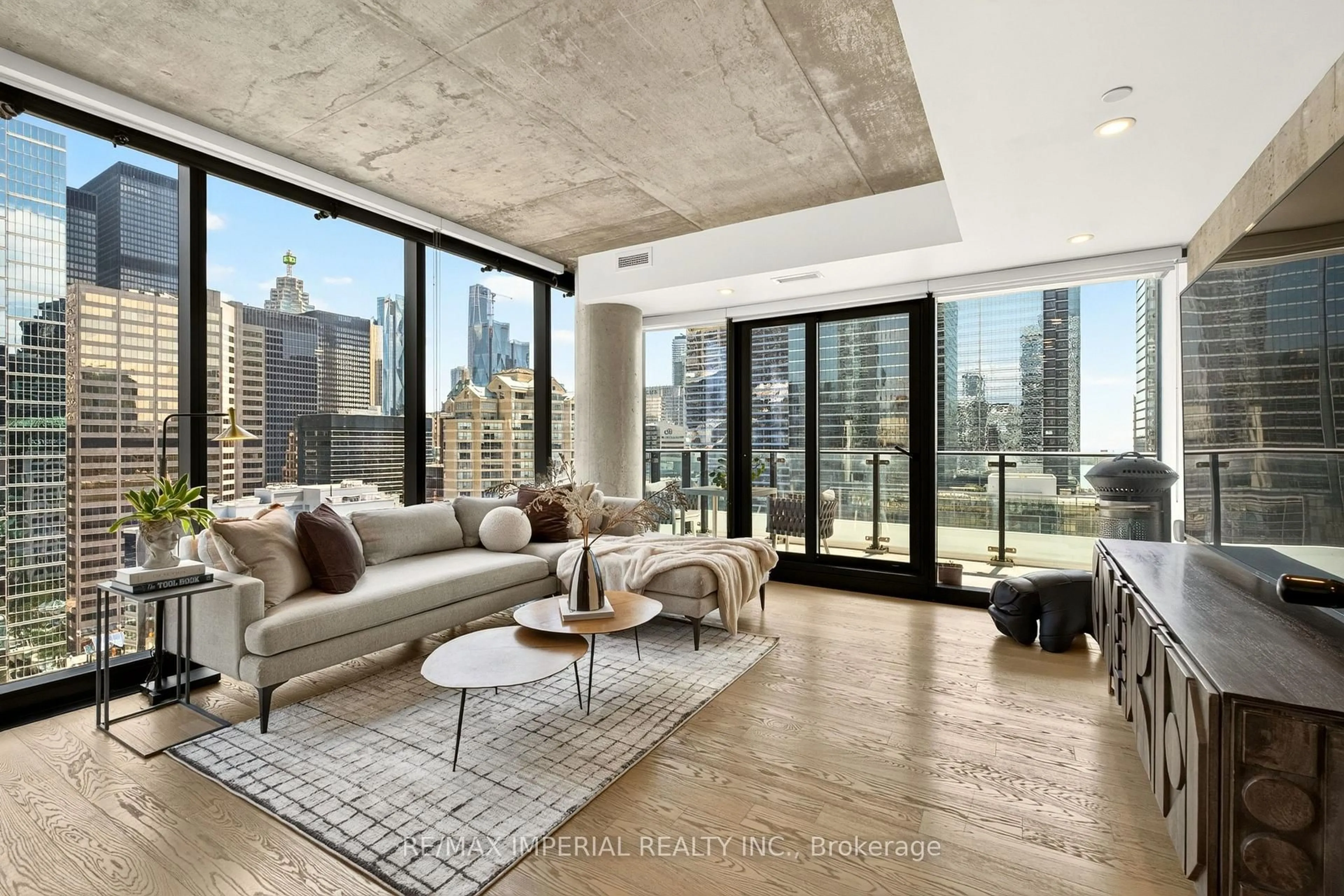 Living room with furniture, cement floor for 224 King St #1804, Toronto Ontario M5H 0A6