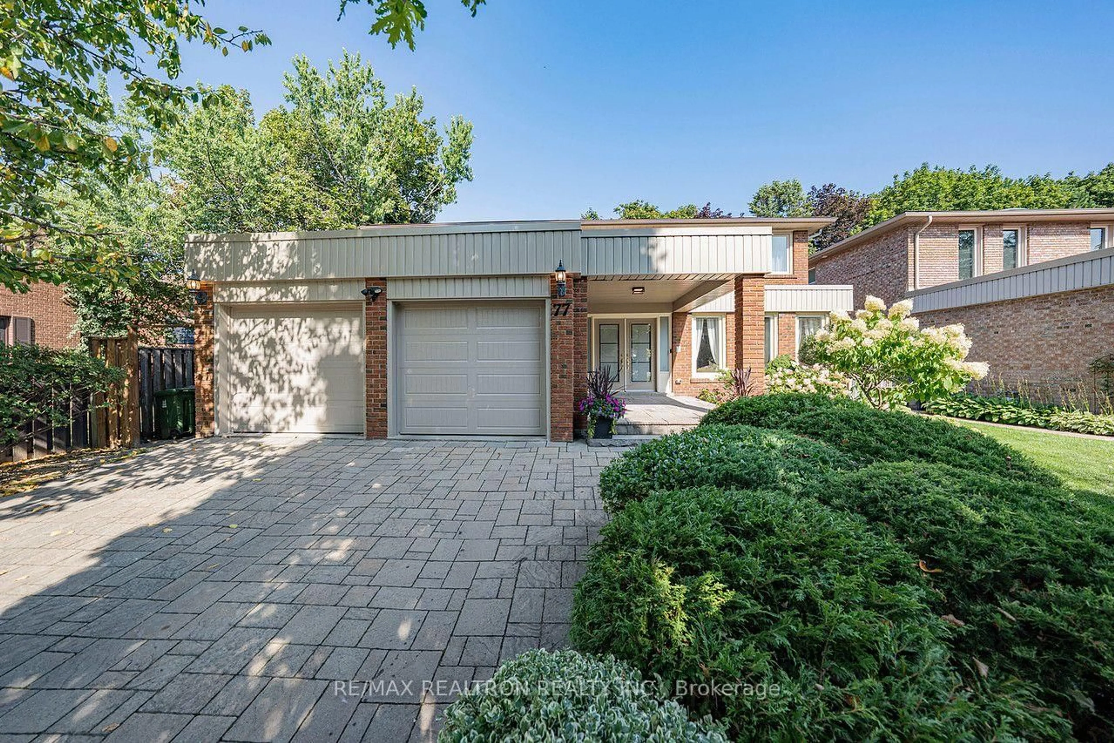 Home with brick exterior material, street for 77 Mossgrove Tr, Toronto Ontario M2L 2W2