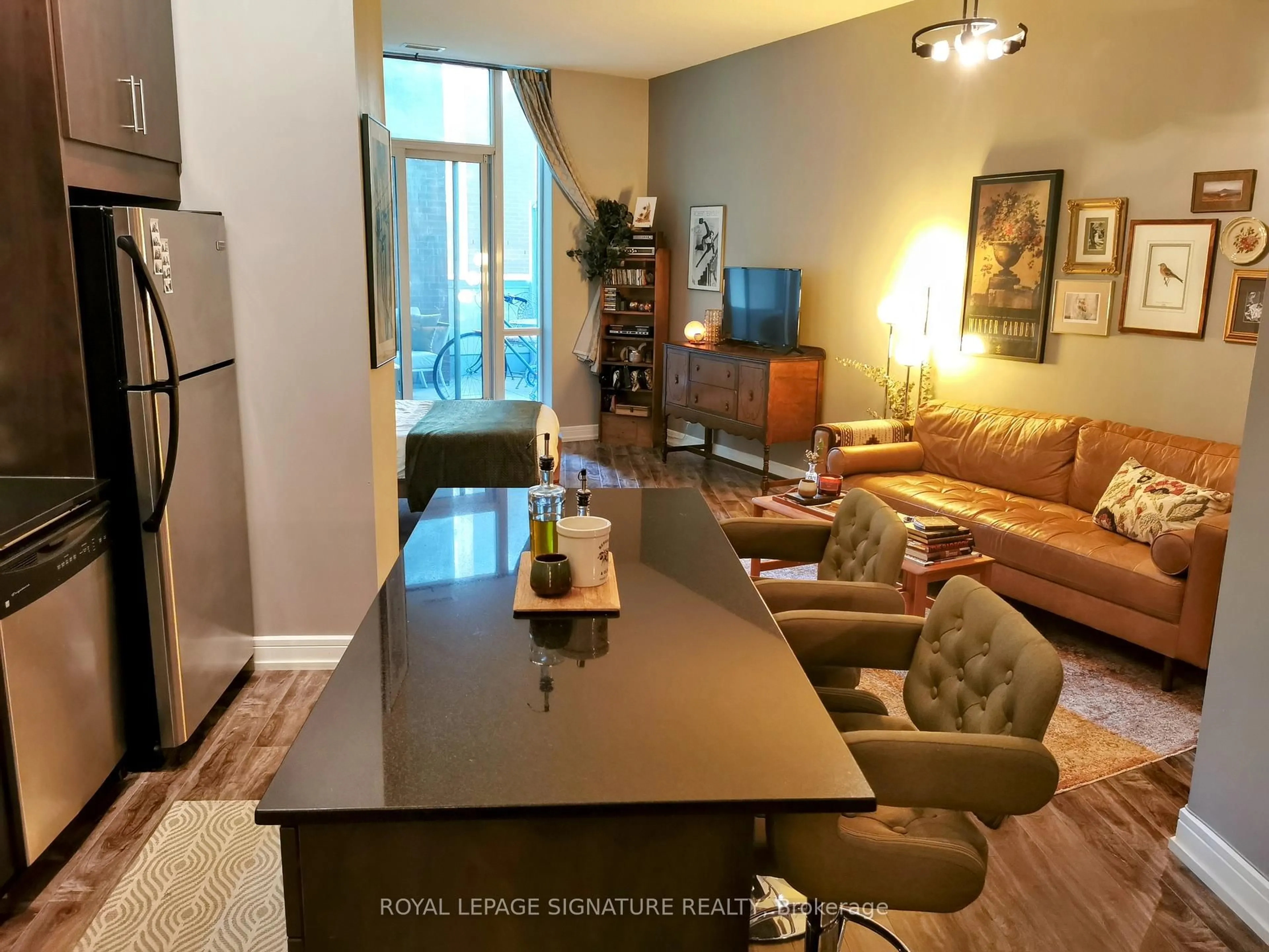Living room with furniture, wood/laminate floor for 112 George St #S202, Toronto Ontario M5A 2M5