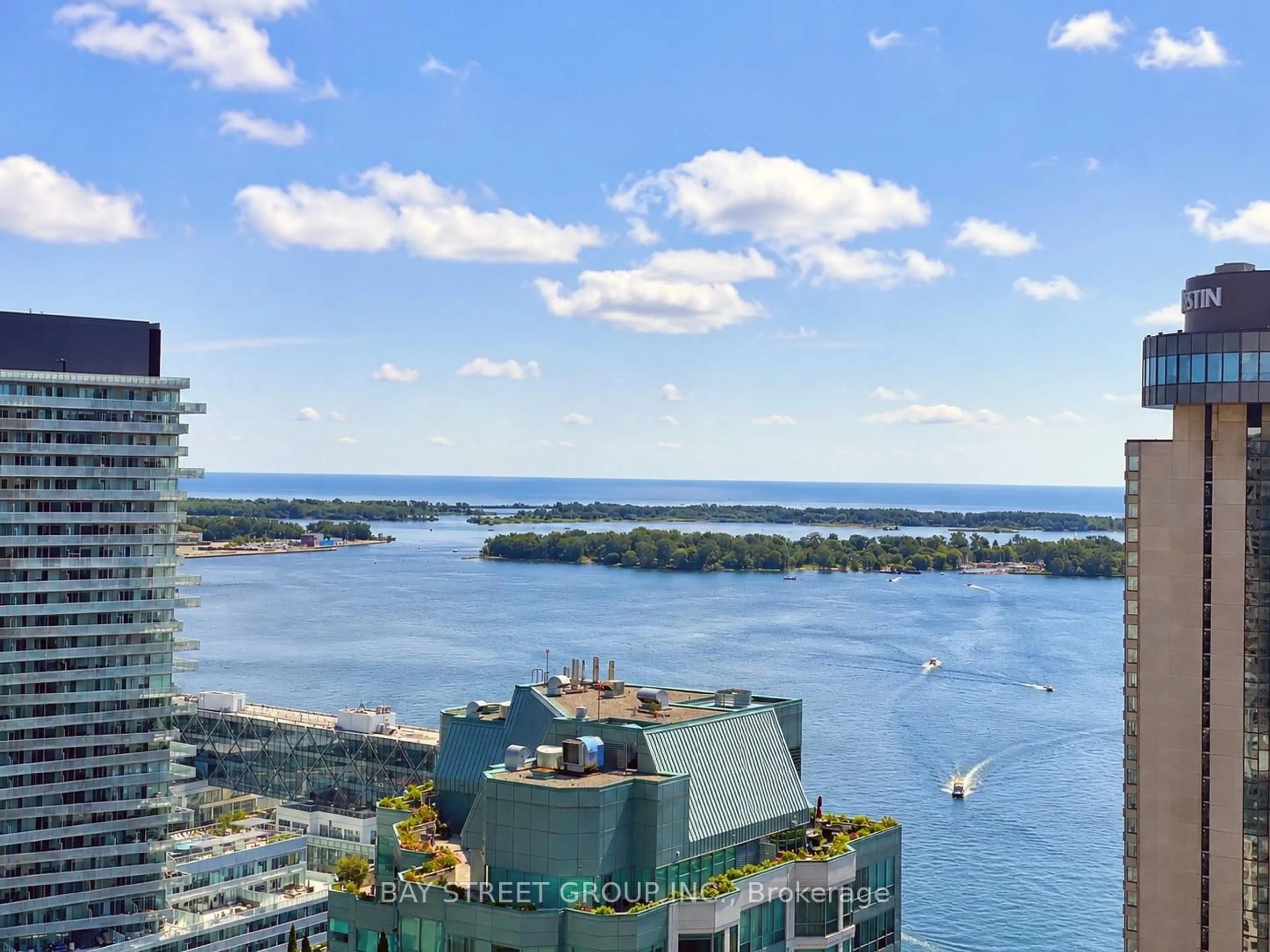 A pic from outside/outdoor area/front of a property/back of a property/a pic from drone, water/lake/river/ocean view for 33 Bay St #3310, Toronto Ontario M5J 2Z3
