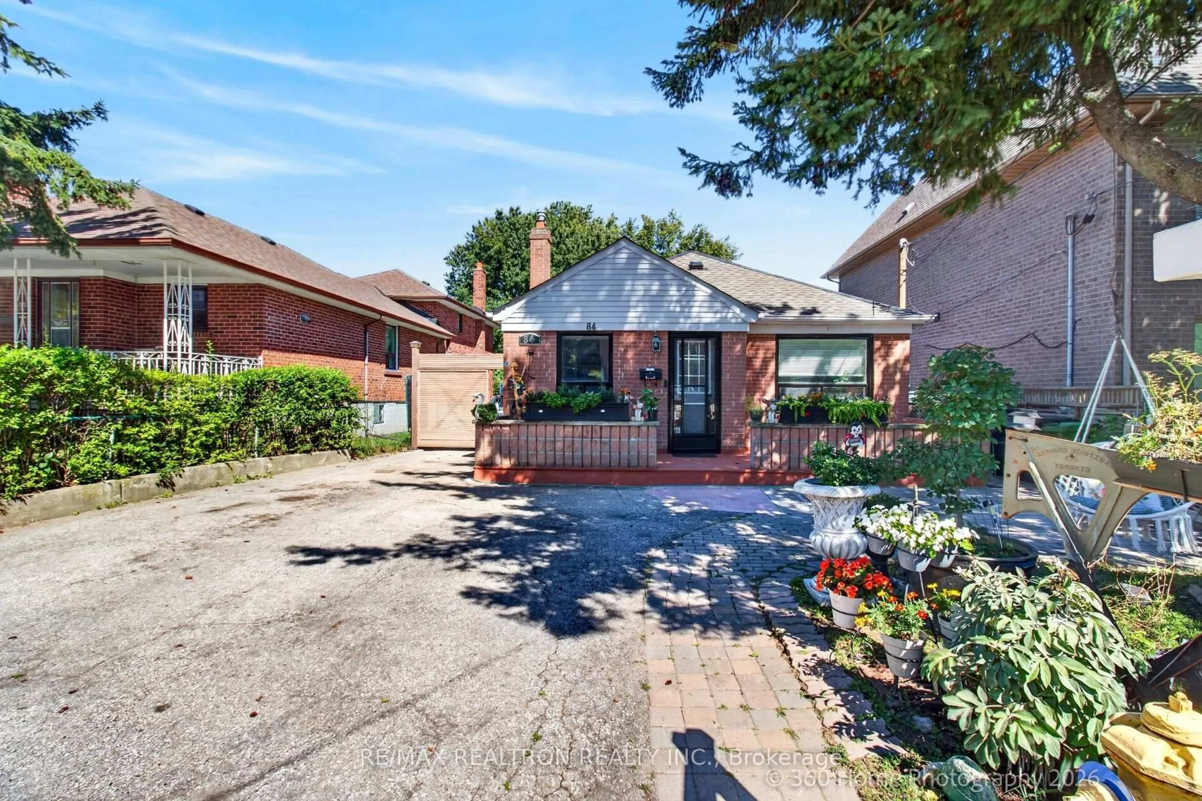 Home with brick exterior material, street for 84 Ranee Ave, Toronto Ontario M6A 1N2