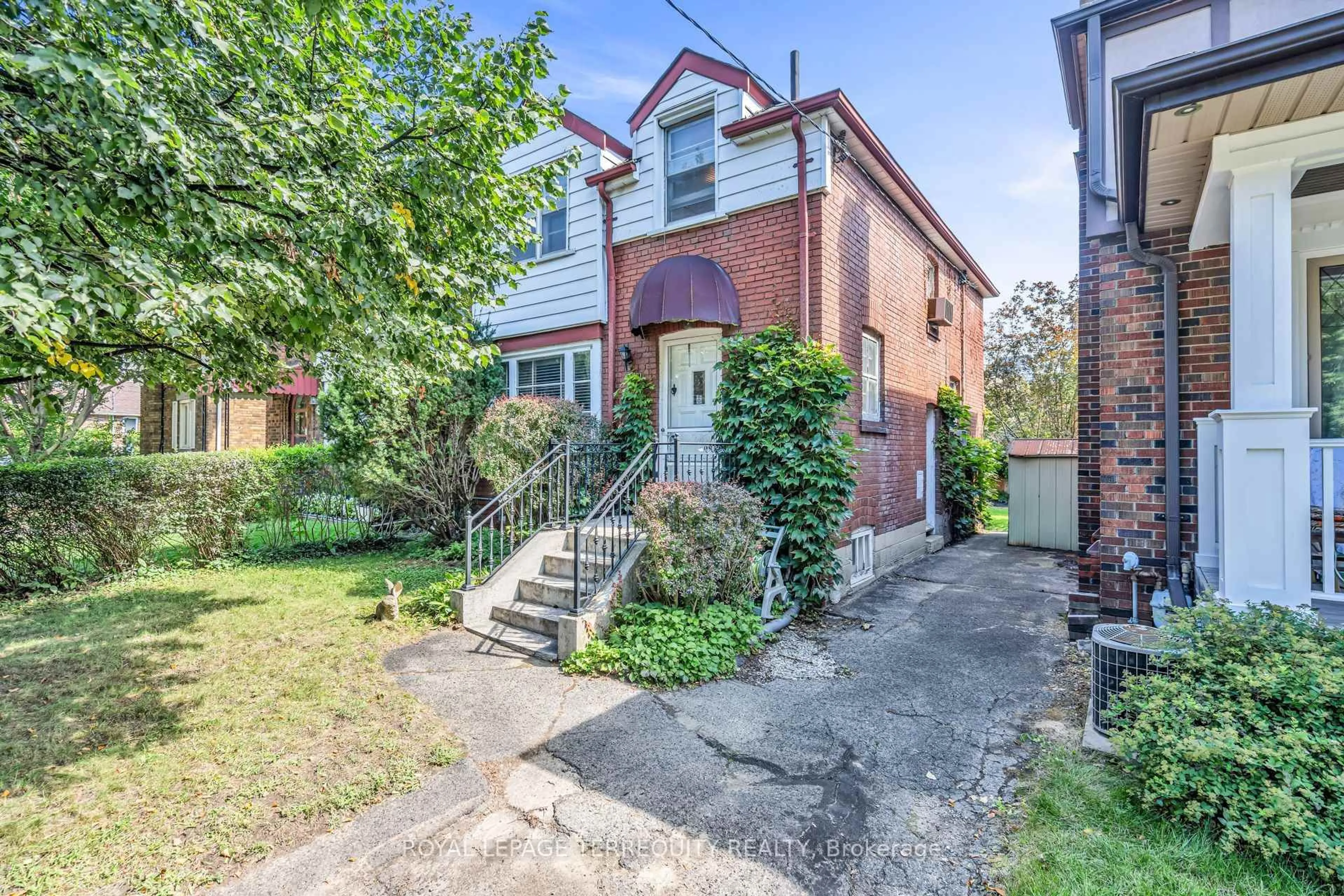 Home with brick exterior material, street for 391 Sutherland Dr, Toronto Ontario M4G 1K1