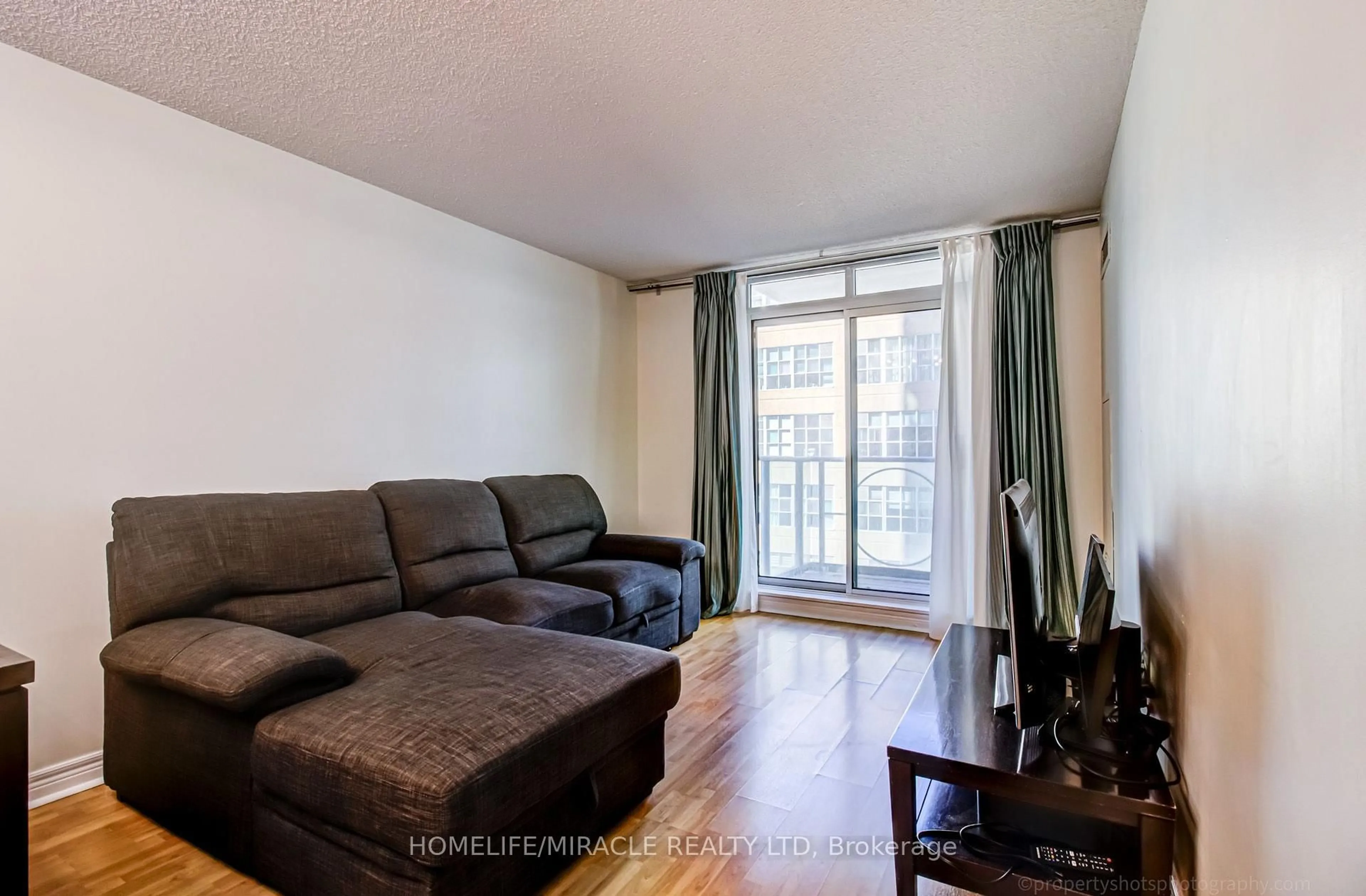 Living room with furniture, unknown for 212 Eglinton Ave #705, Toronto Ontario M4P 0A3