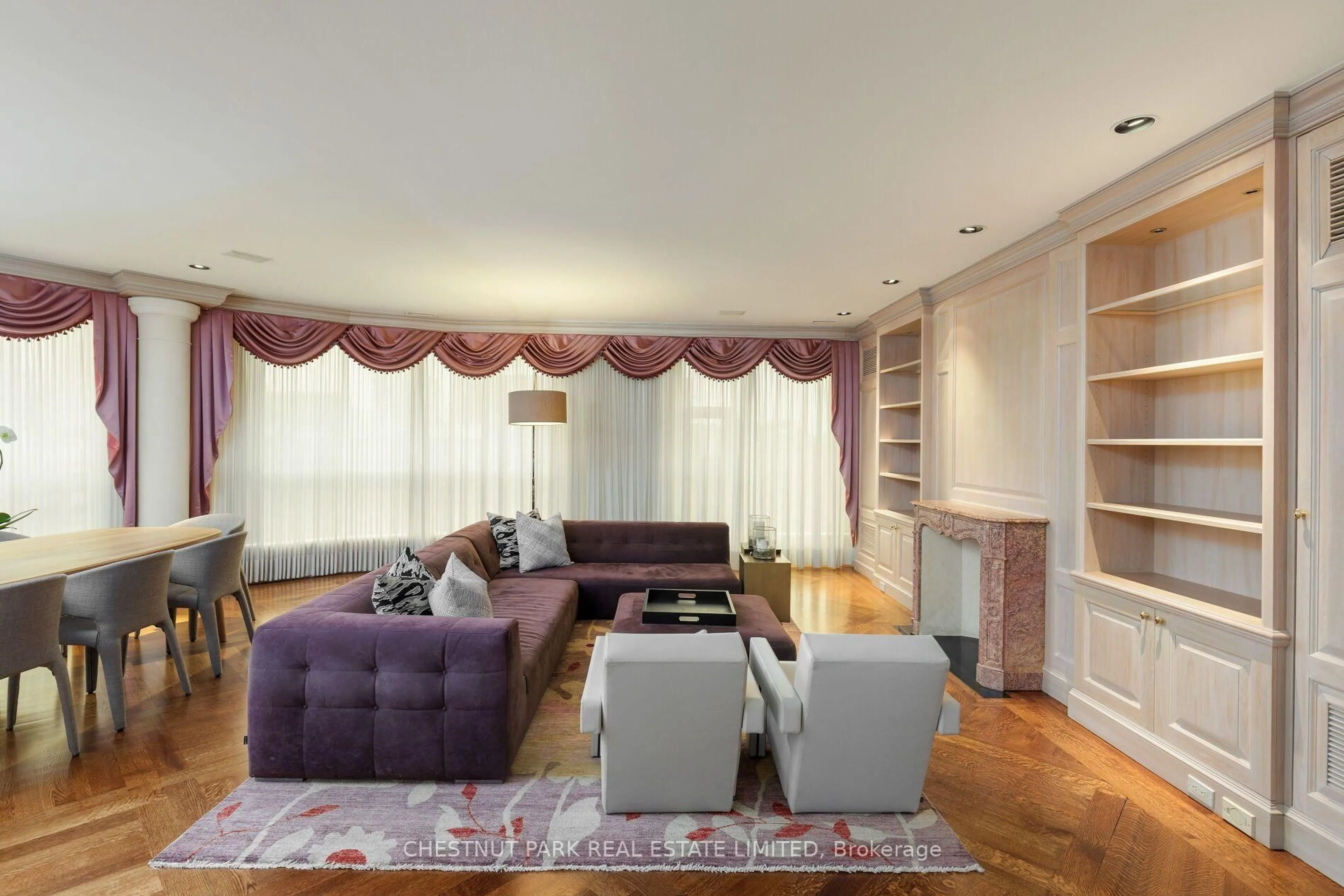 Living room with furniture, wood/laminate floor for 77 Avenue Rd #612, Toronto Ontario M5R 3R8