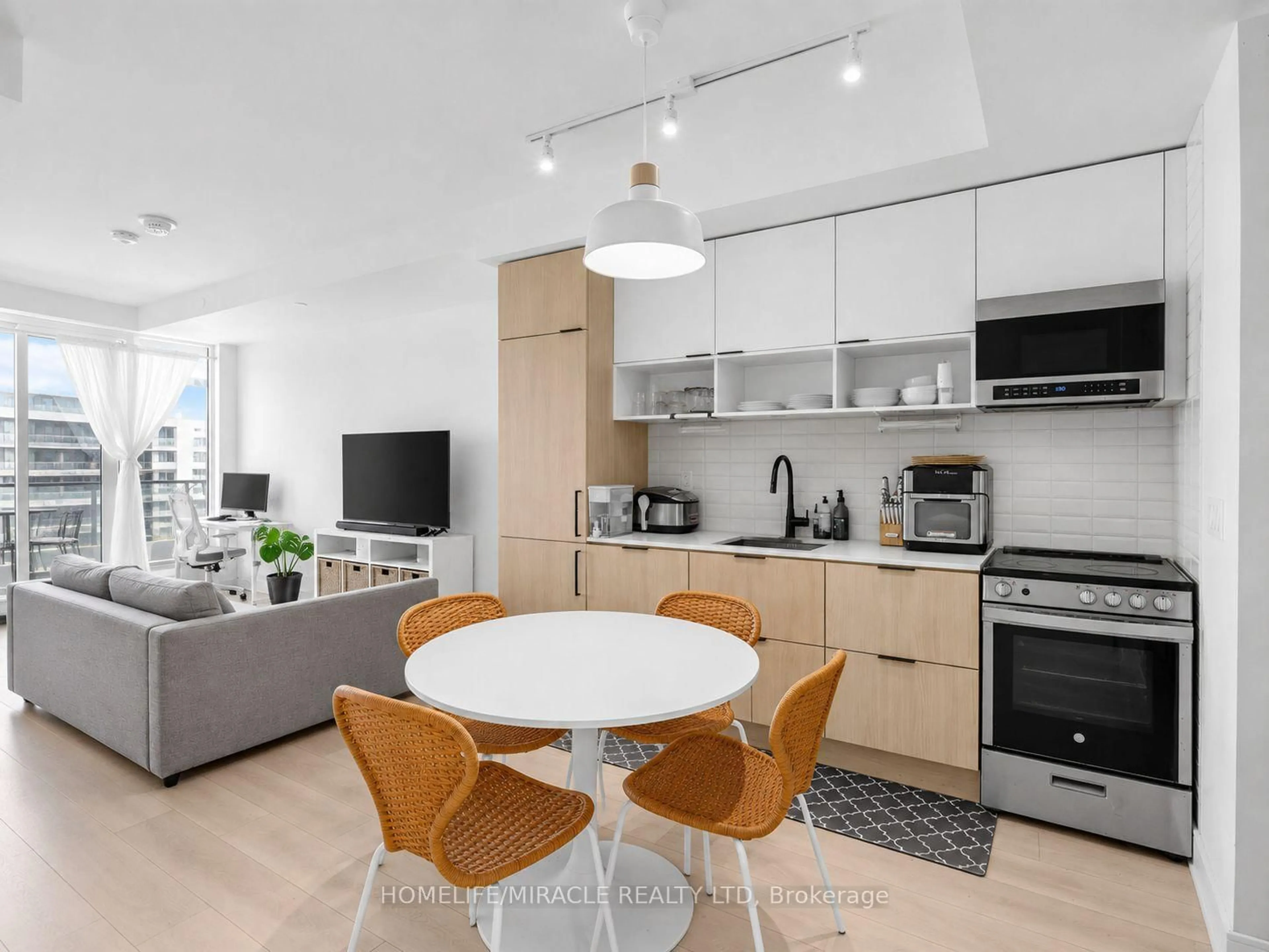 Open concept kitchen, wood/laminate floor for 35 Rolling Mills Rd #N808, Toronto Ontario M5A 0V6