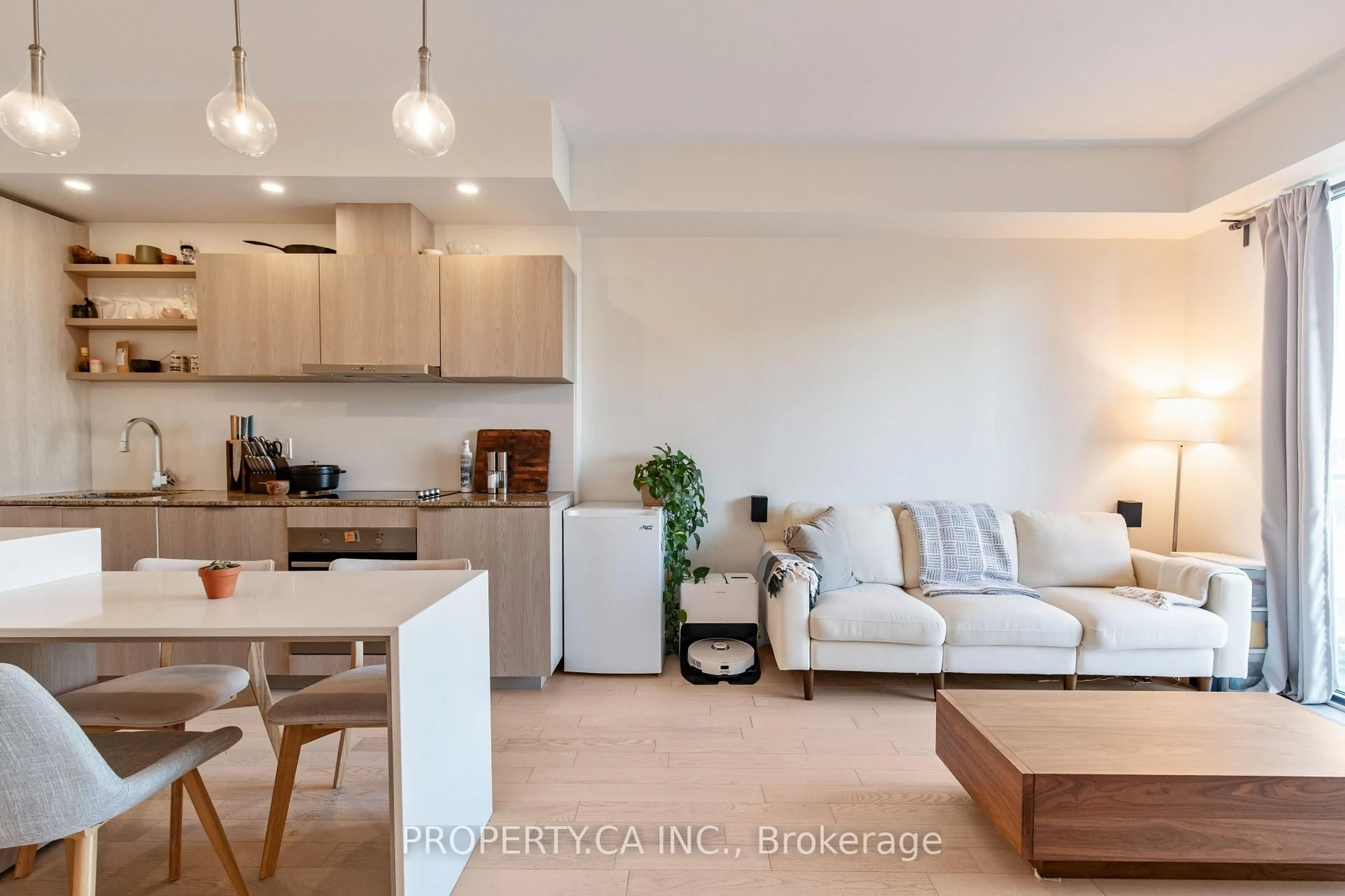 Living room with furniture, wood/laminate floor for 12 Bonnycastle St #710, Toronto Ontario M5A 0C8