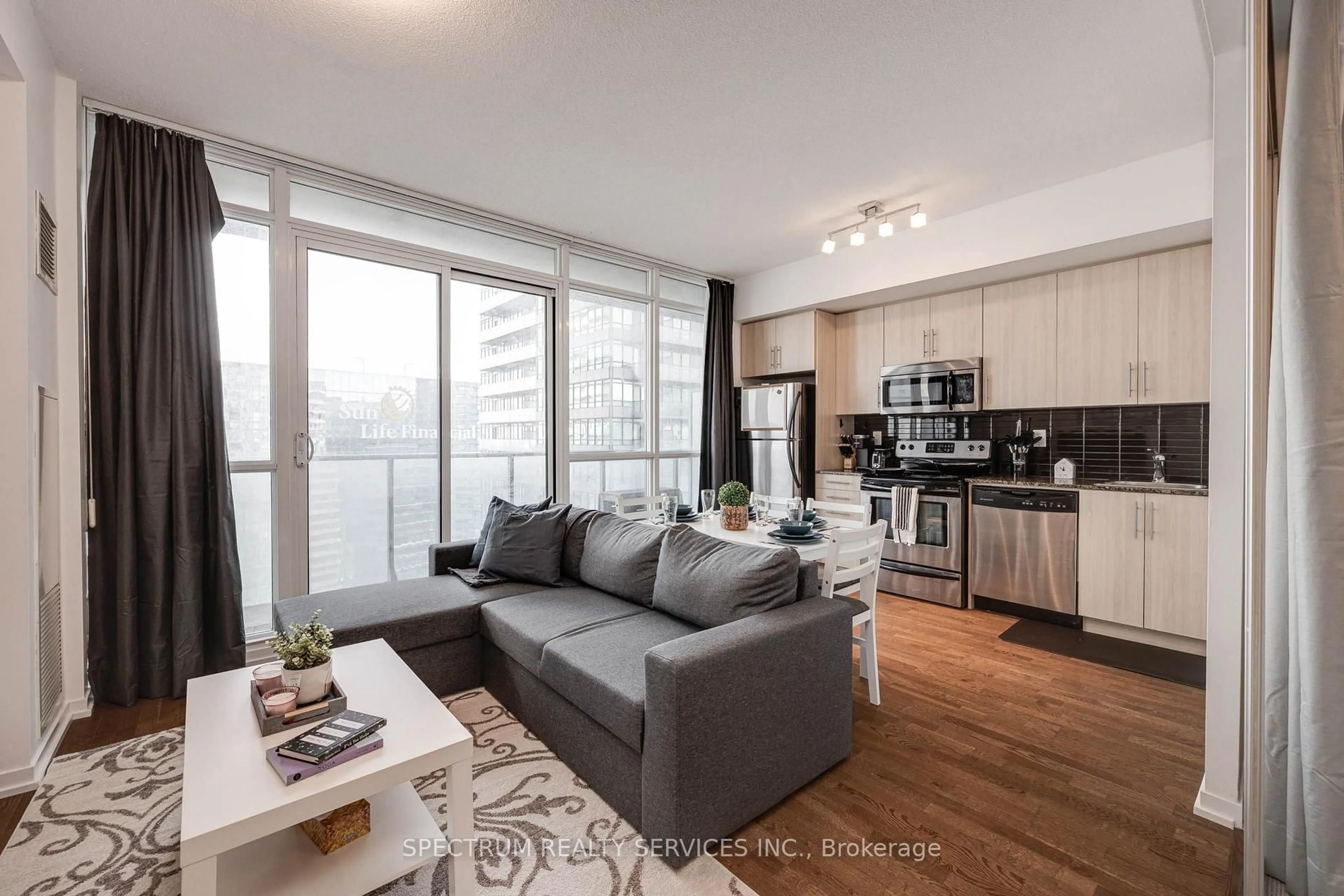 Living room with furniture, wood/laminate floor for 65 Bremner Blvd #4511, Toronto Ontario M5J 0A6