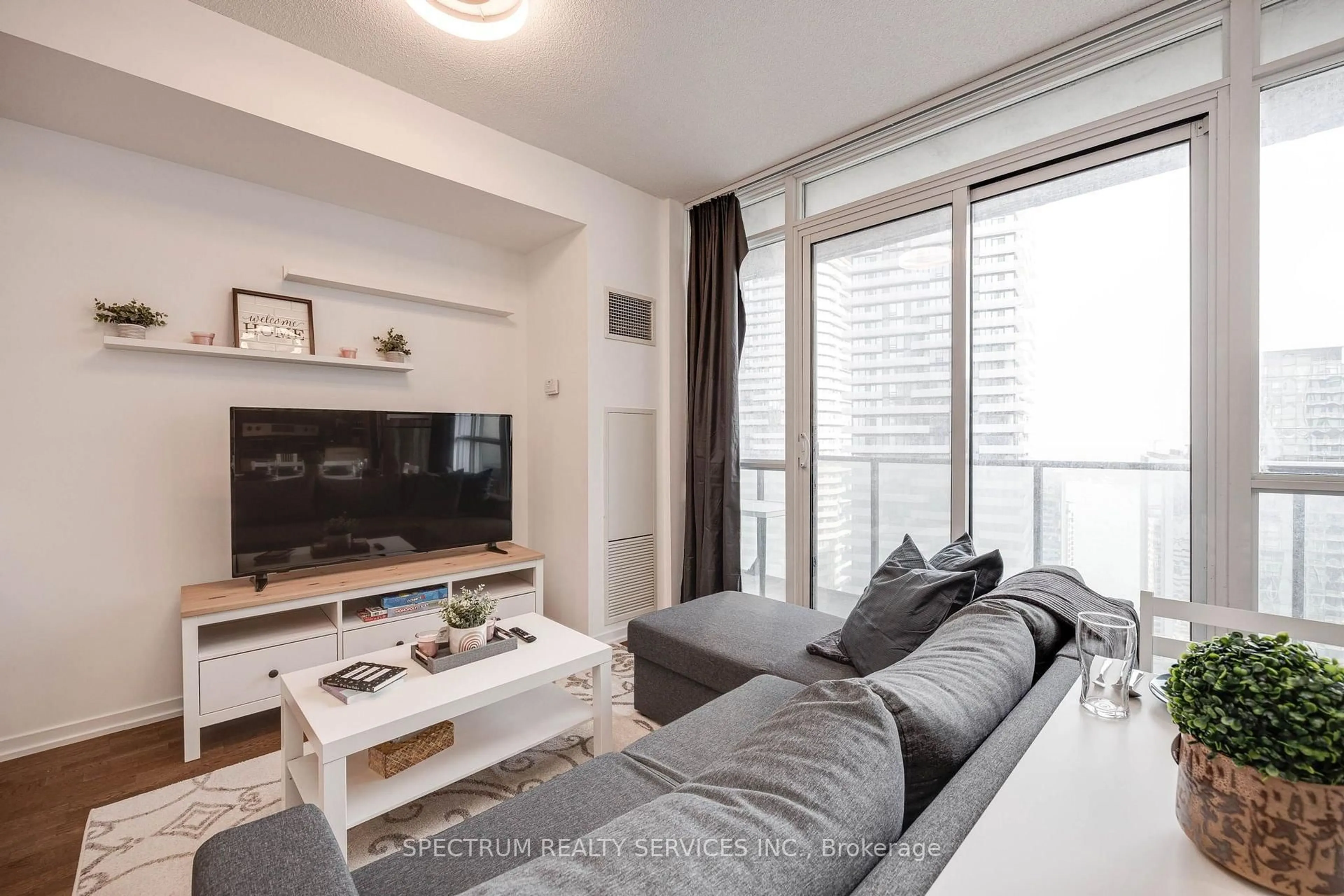 Living room with furniture, unknown for 65 Bremner Blvd #4511, Toronto Ontario M5J 0A6