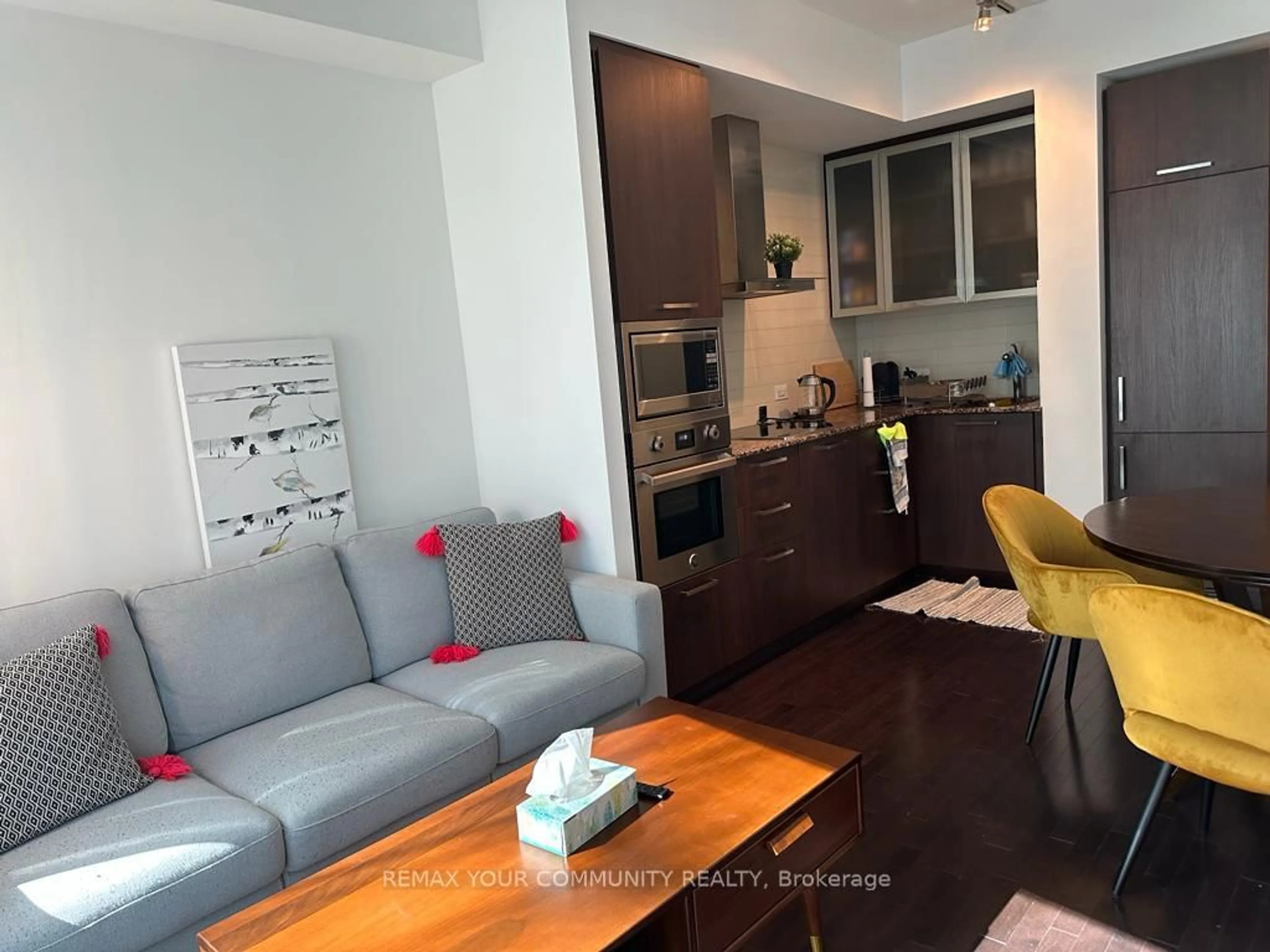 Living room with furniture, wood/laminate floor for 14 York St #1709, Toronto Ontario M5J 0B1