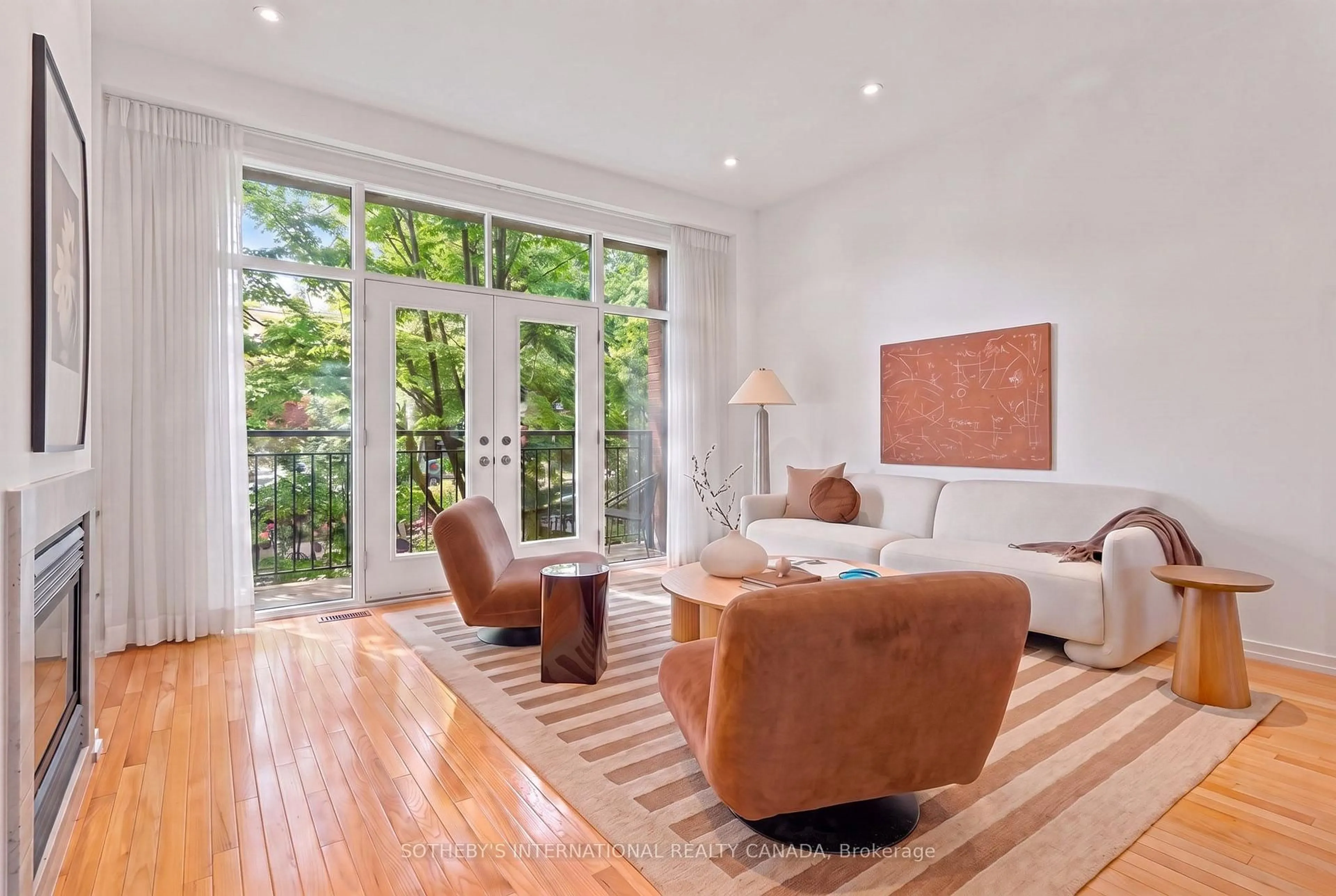 Living room with furniture, wood/laminate floor for 2 Sibelius Lane, Toronto Ontario M5R 3V8
