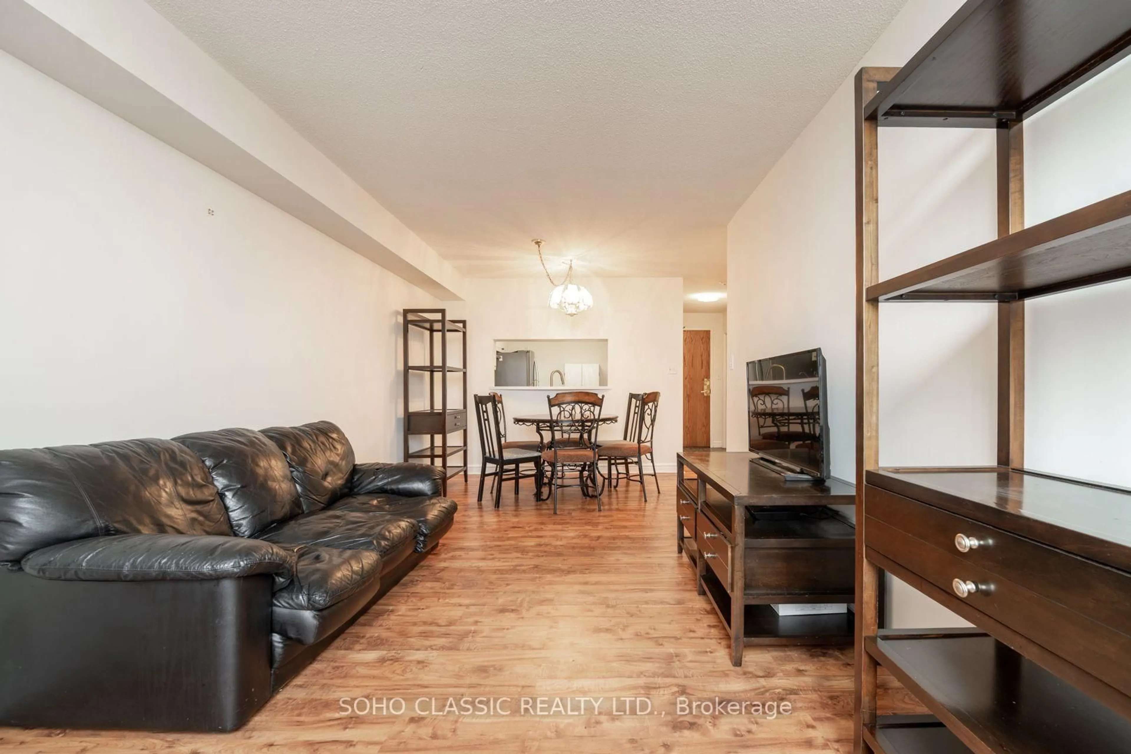 Living room with furniture, wood/laminate floor for 1700 Eglinton Ave #809, Toronto Ontario M4A 2X4