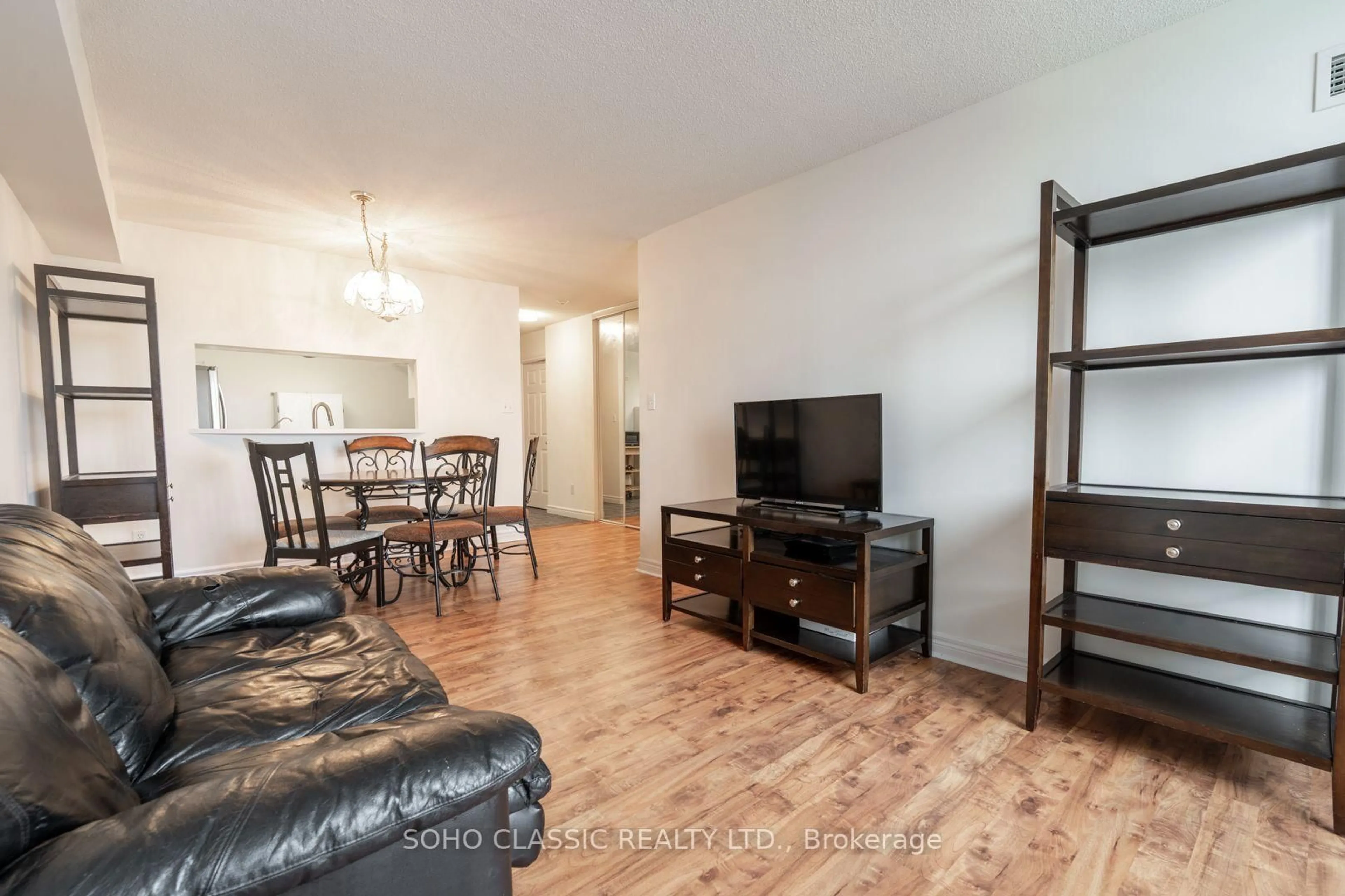Living room with furniture, wood/laminate floor for 1700 Eglinton Ave #809, Toronto Ontario M4A 2X4