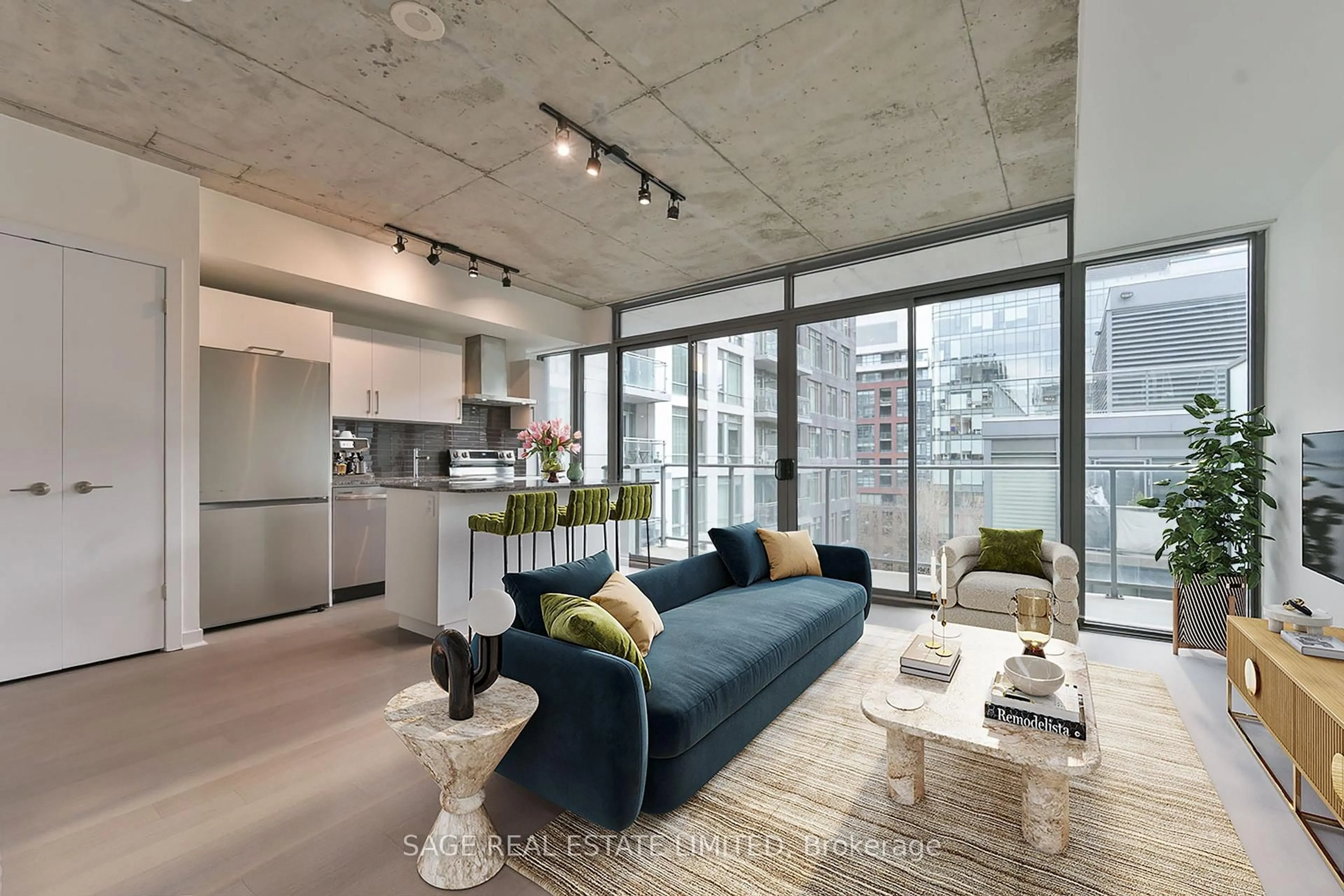 Living room with furniture, cement floor for 95 Bathurst St #914, Toronto Ontario M5V 0H7