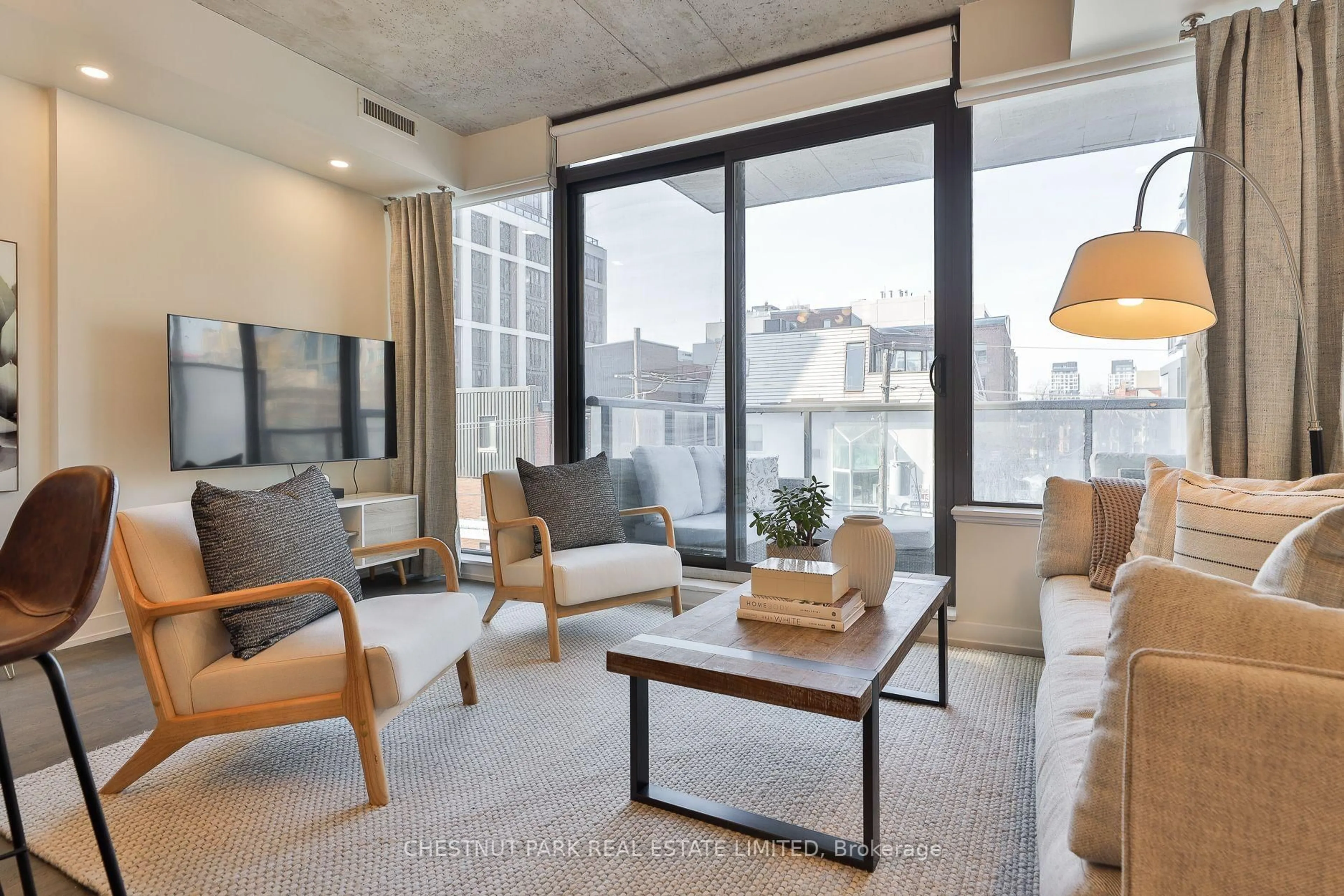 Living room with furniture, cement floor for 461 Adelaide St #434, Toronto Ontario M5V 0L6