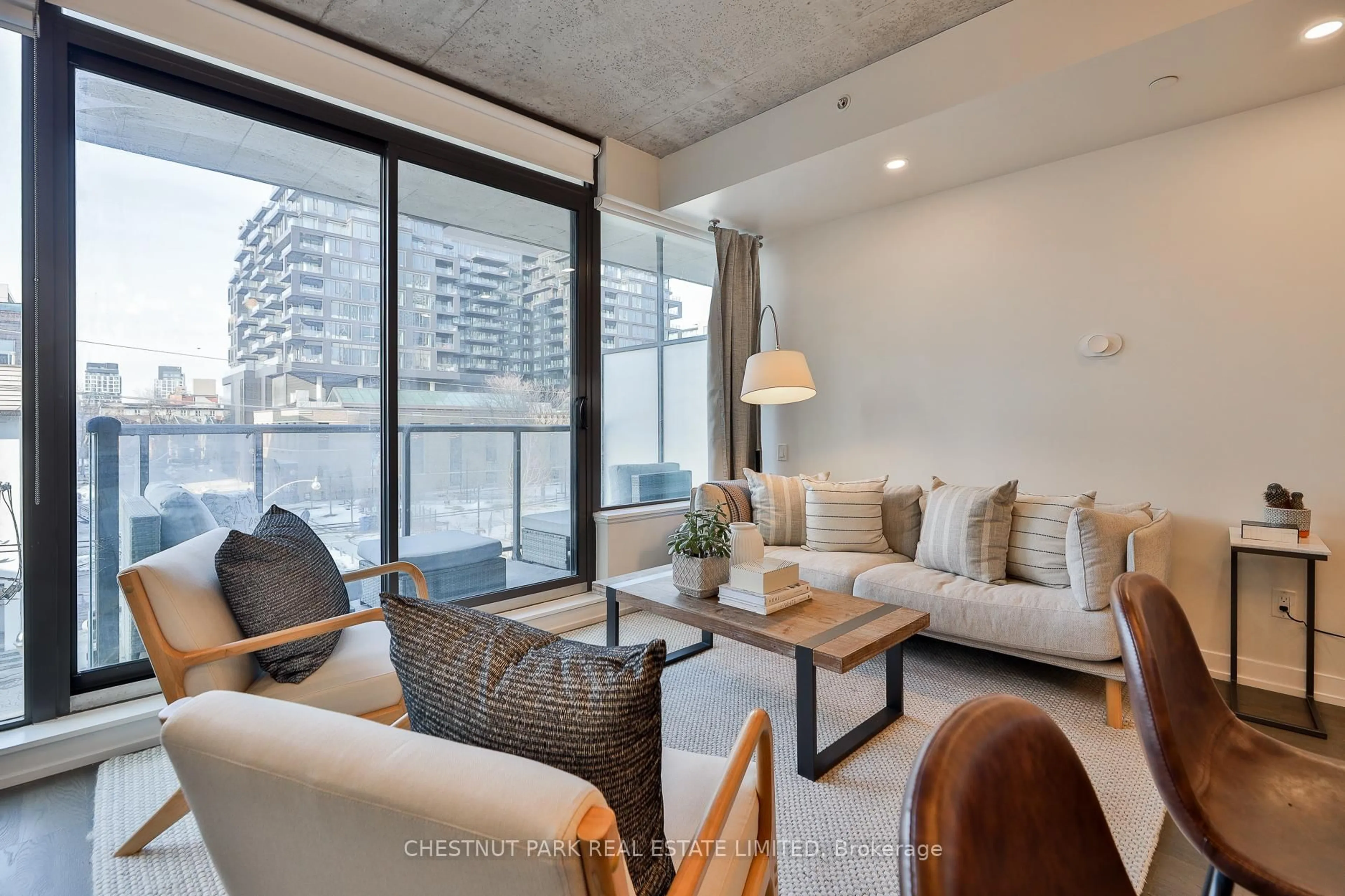 Living room with furniture, cement floor for 461 Adelaide St #434, Toronto Ontario M5V 0L6