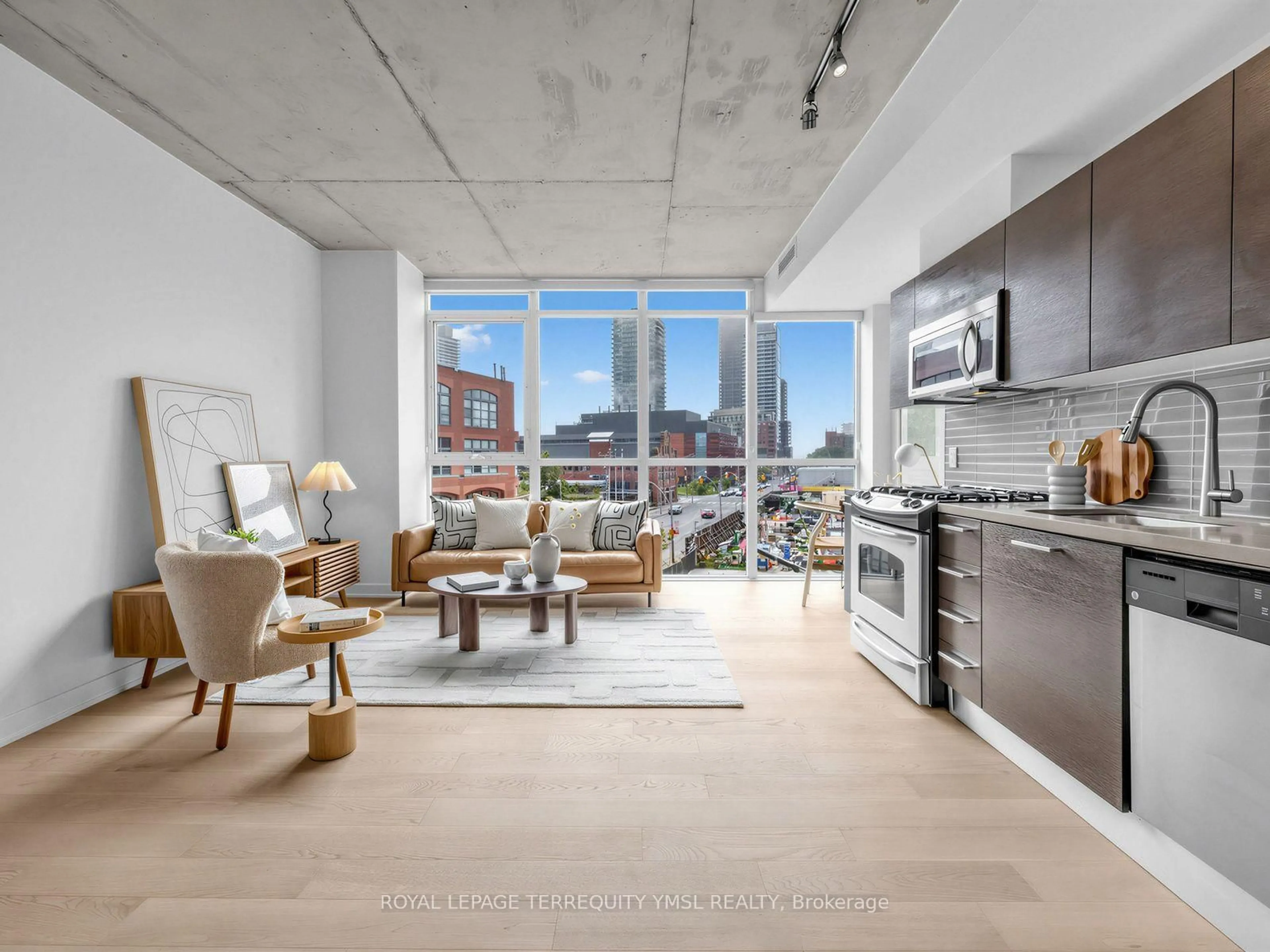 Open concept kitchen, cement floor for 318 King St #308, Toronto Ontario M5A 0C1
