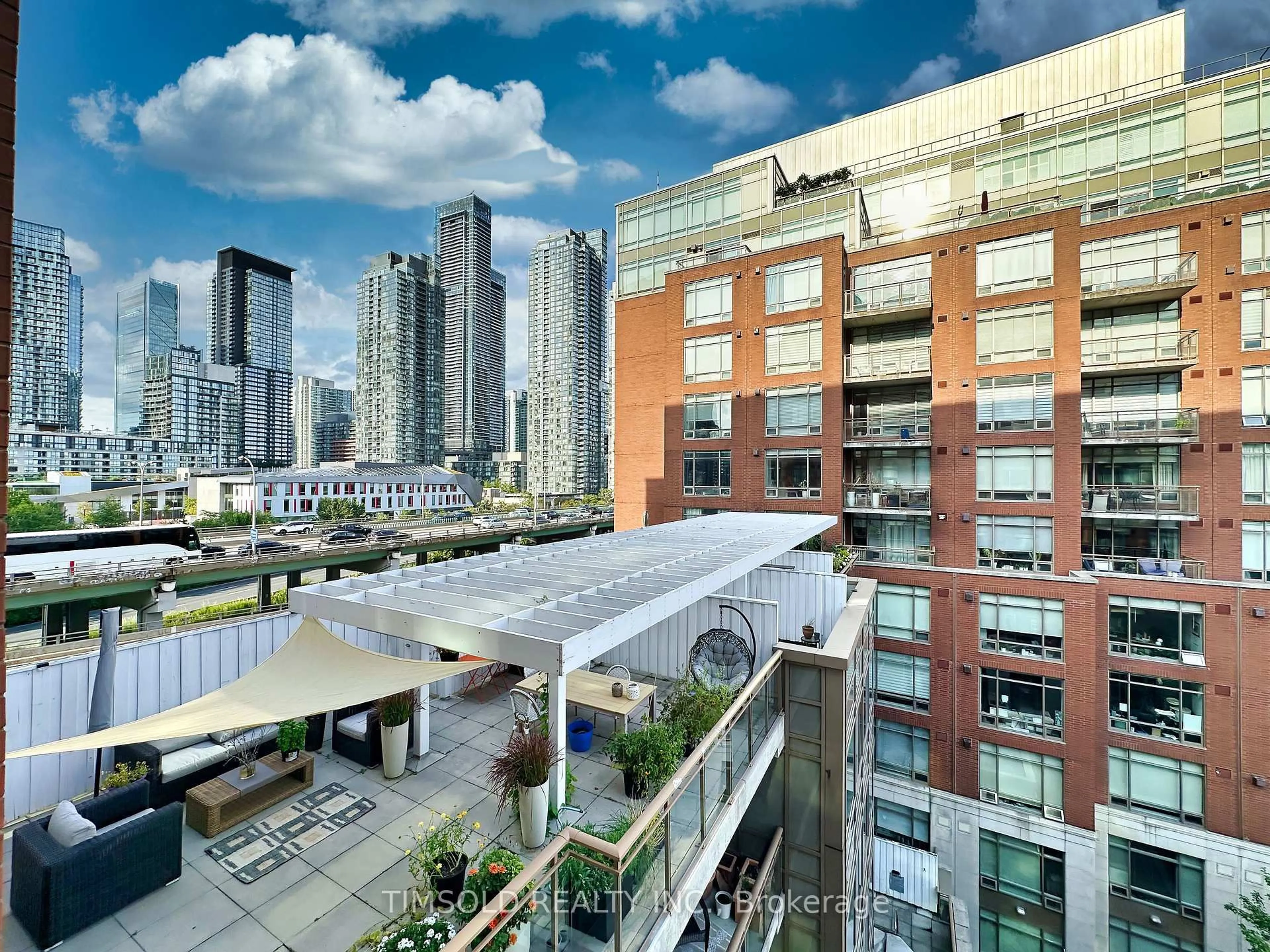 Patio, city buildings view from balcony for 500 Queens Quay #708W, Toronto Ontario M5V 3K8
