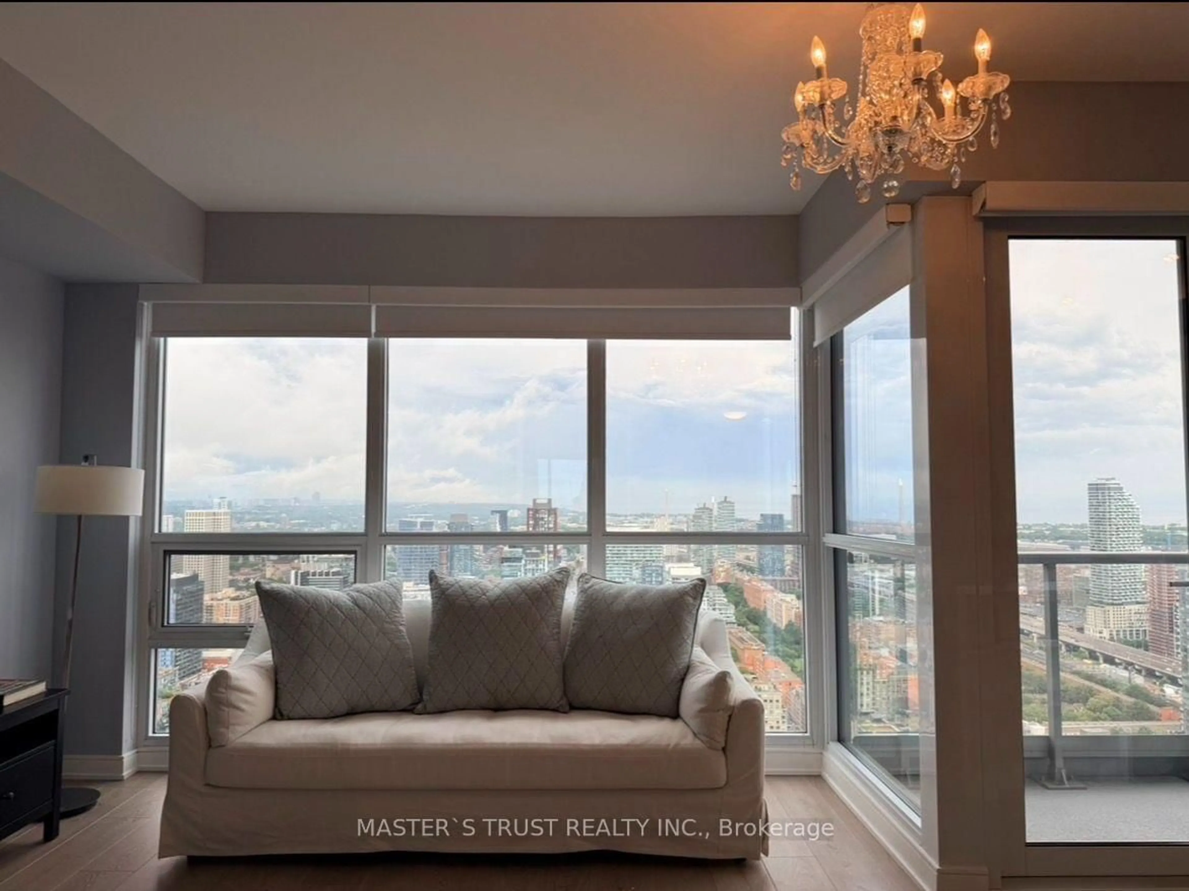 Living room with furniture, unknown for 88 Scott St #4106, Toronto Ontario M5E 0A9