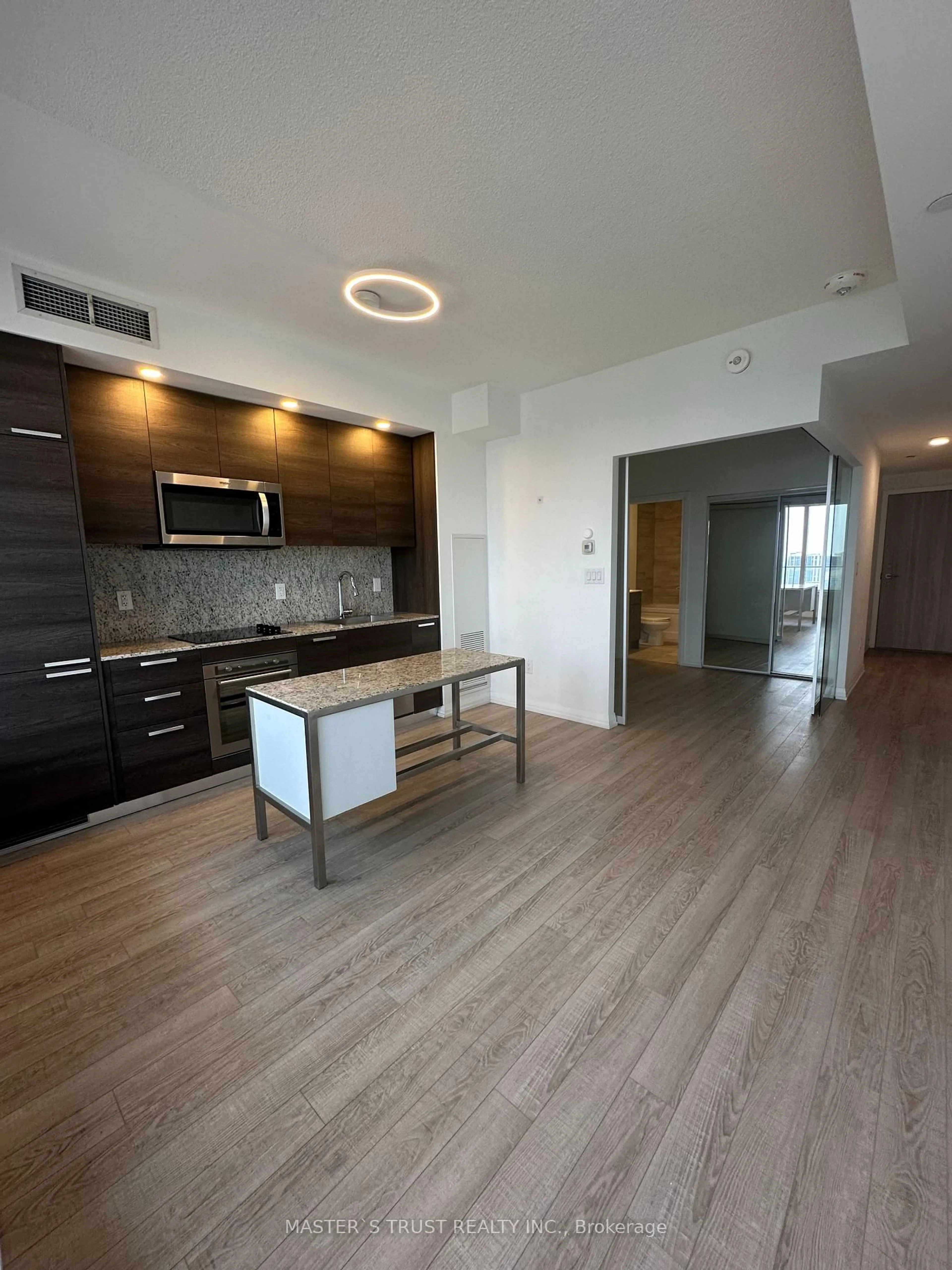 Open concept kitchen, wood/laminate floor for 75 Canterbury Pl #2705, Toronto Ontario M2N 0L2