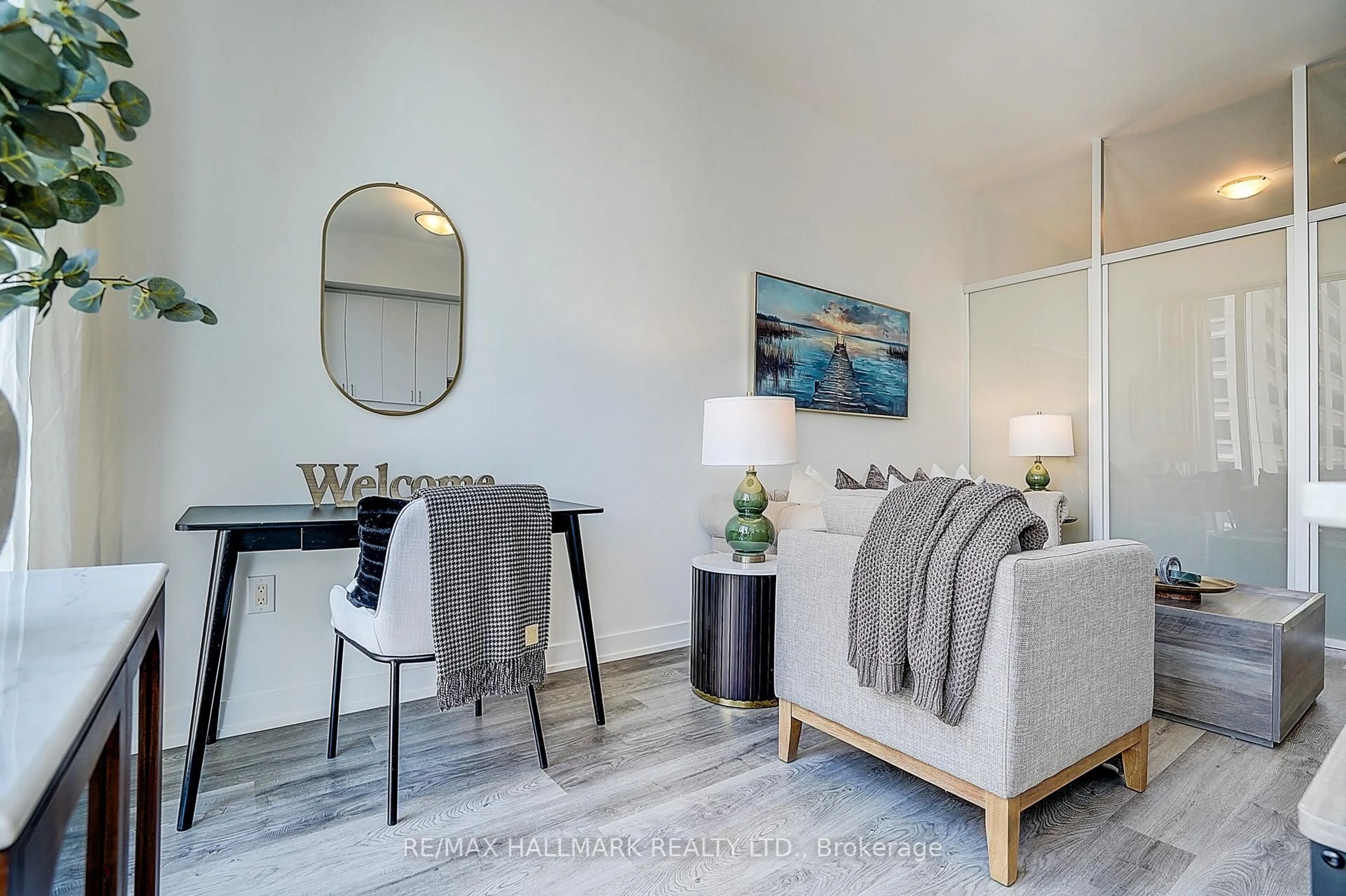 Living room with furniture, wood/laminate floor for 426 University Ave #2009, Toronto Ontario M5G 1S9