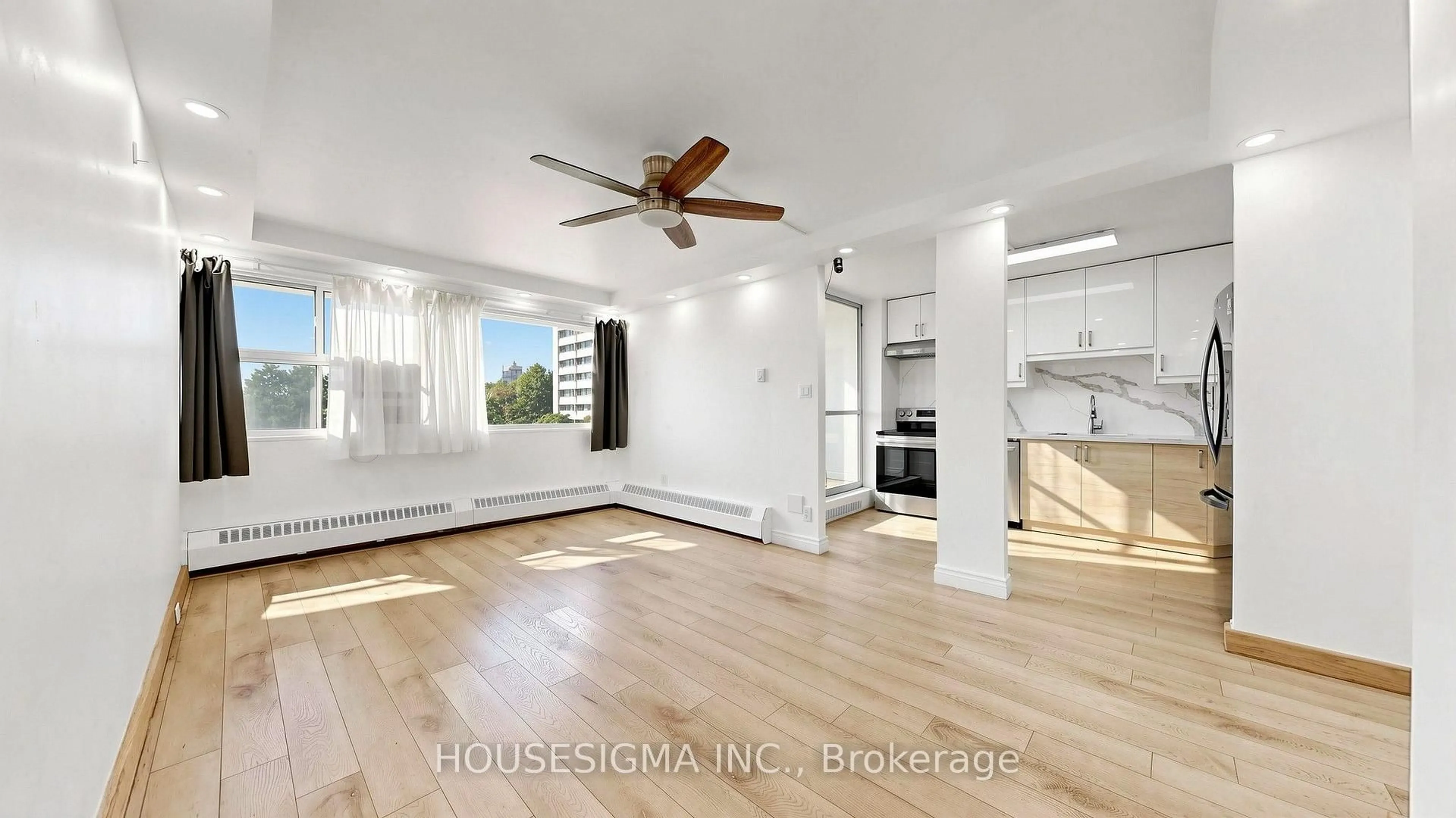 Open concept kitchen, wood/laminate floor for 725 Don Mills Rd #305, Toronto Ontario M3C 1S6