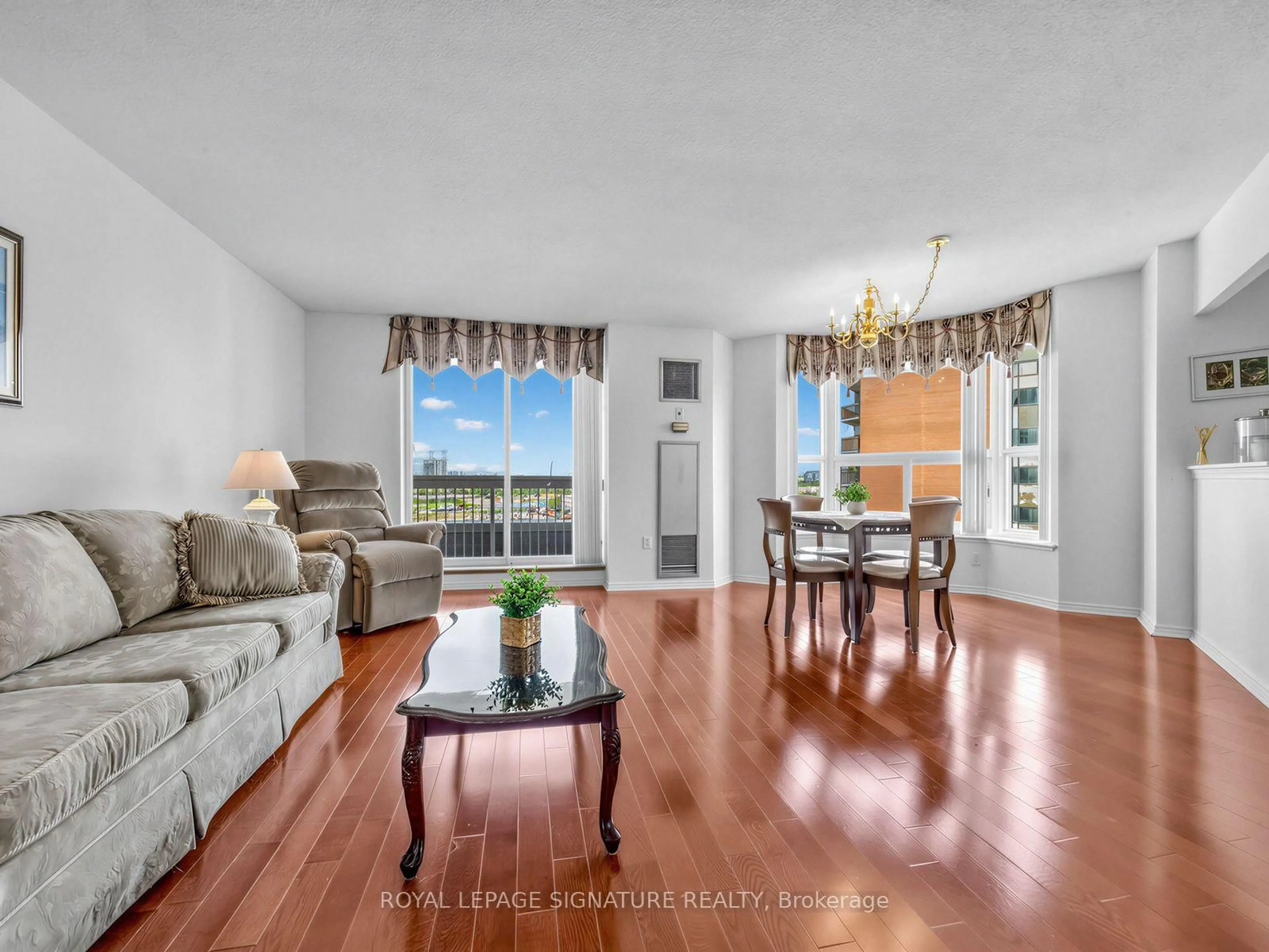 Living room with furniture, wood/laminate floor for 11 Thorncliffe Park Dr #807, Toronto Ontario M4H 1P3