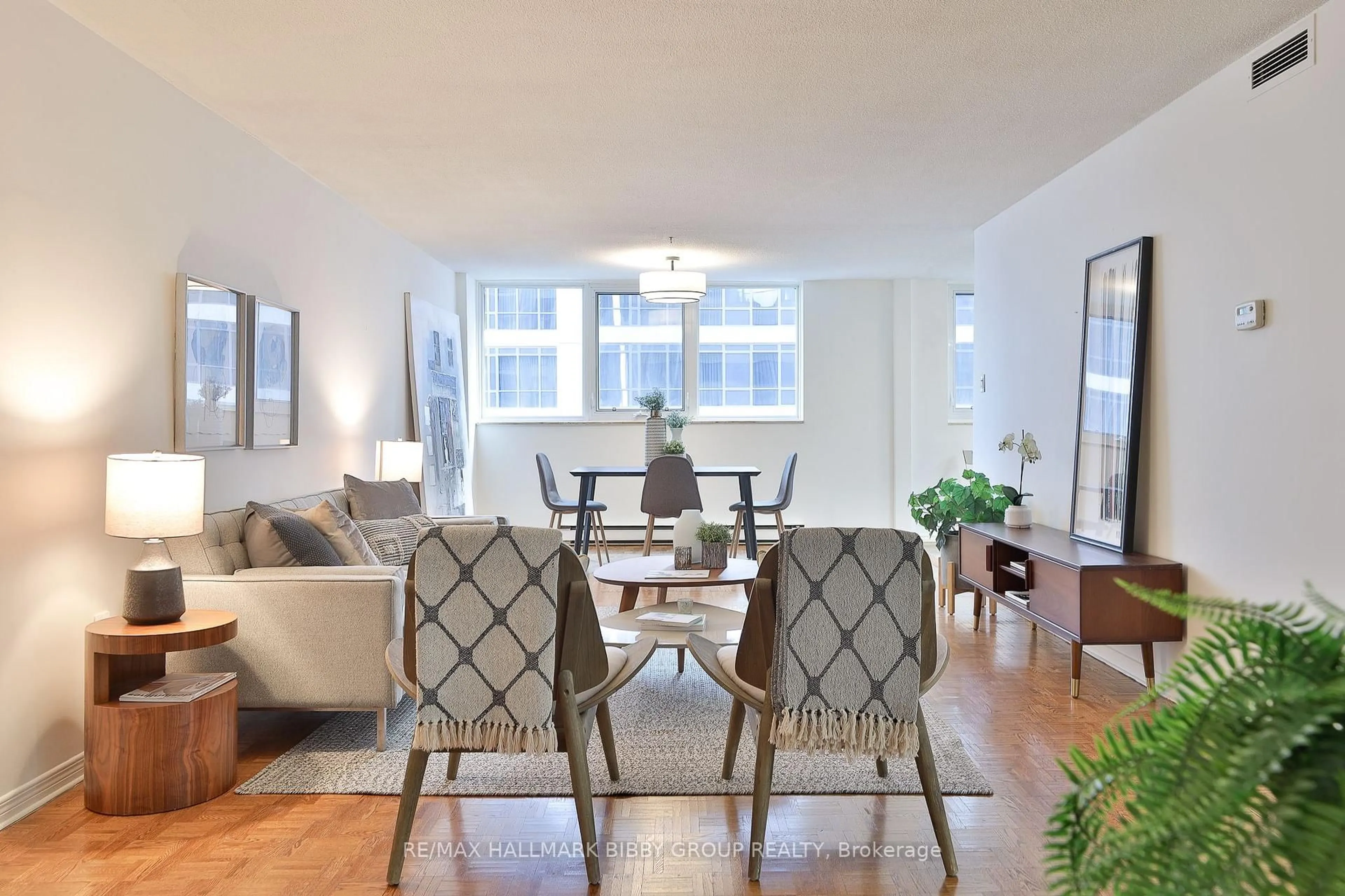 Living room with furniture, wood/laminate floor for 360 Bloor St #1007, Toronto Ontario M4W 3M3
