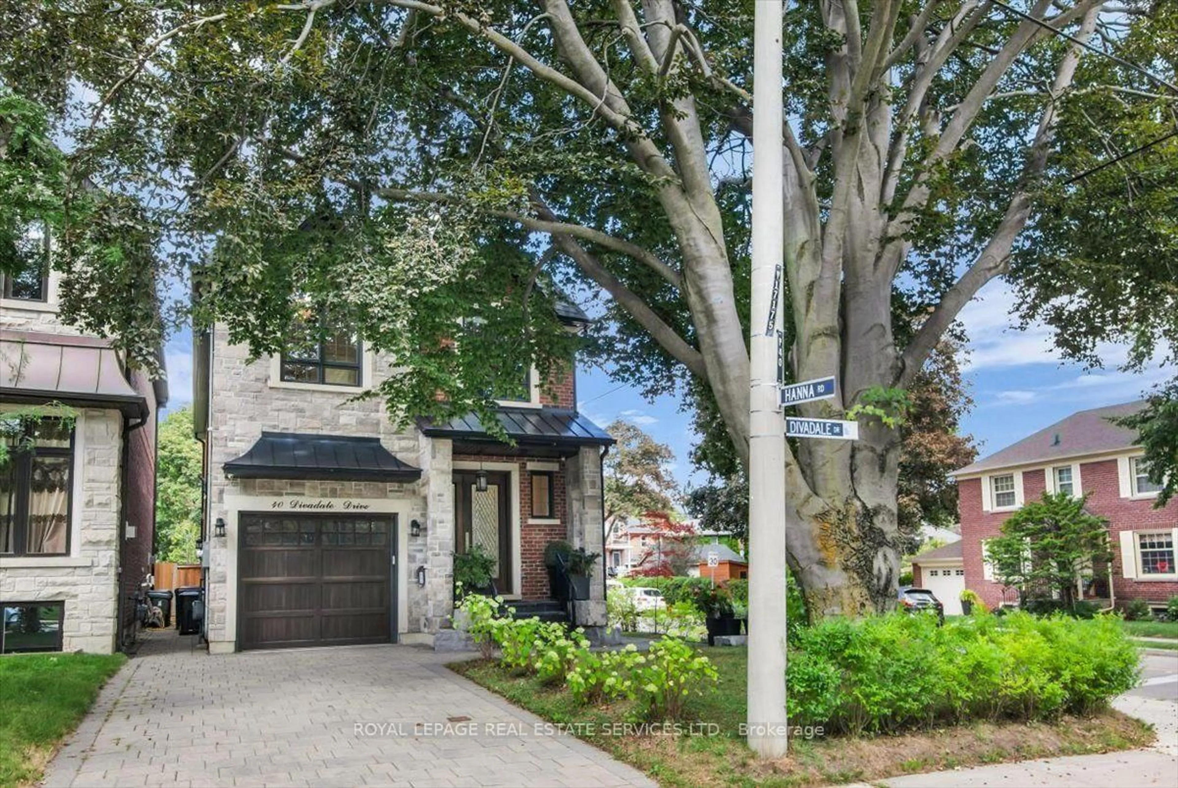 Home with brick exterior material, street for 40 Divadale Dr, Toronto Ontario M4G 2N9