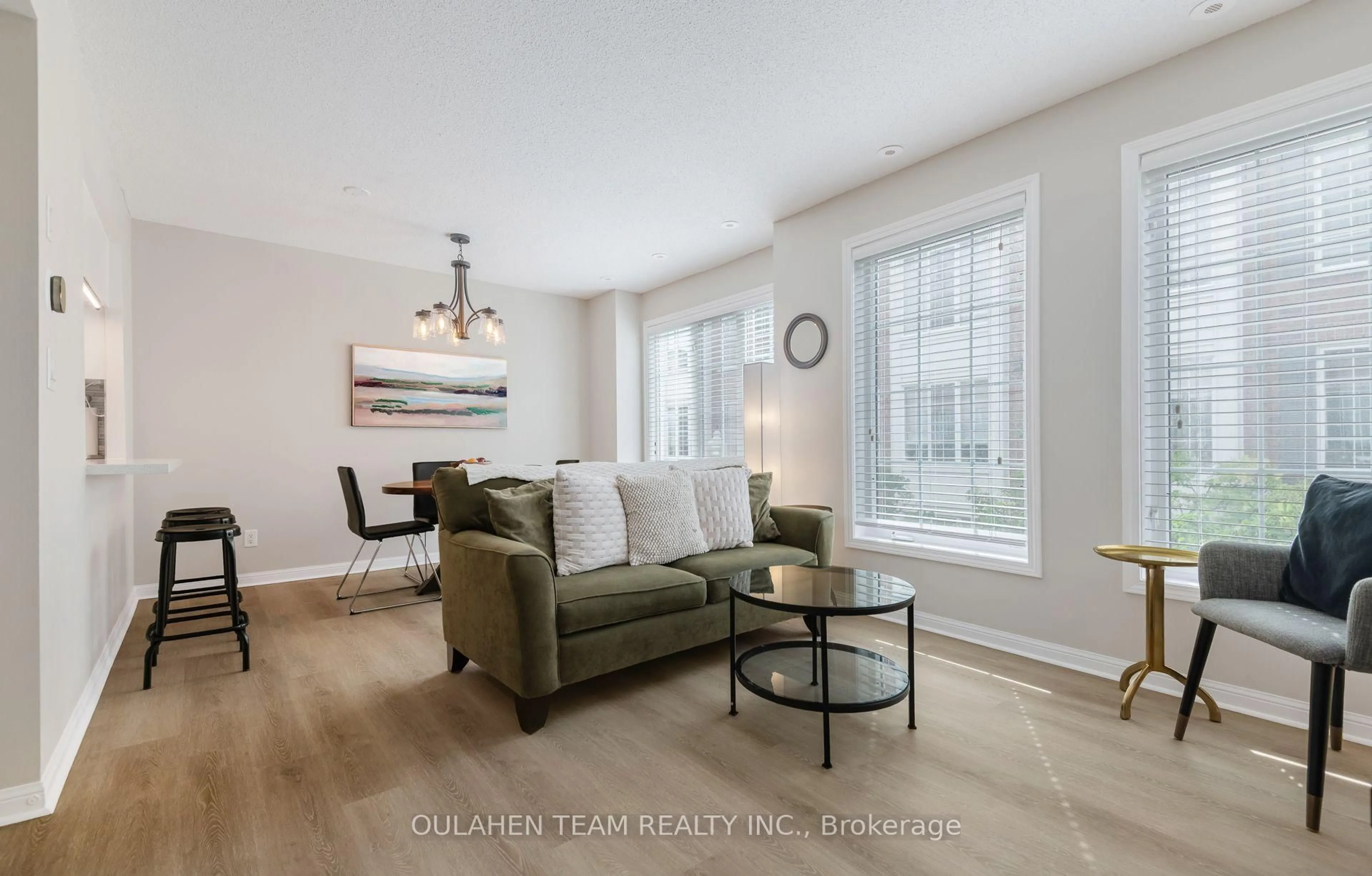 Living room with furniture, wood/laminate floor for 5 Everson Dr #1011, Toronto Ontario M2N 7C3