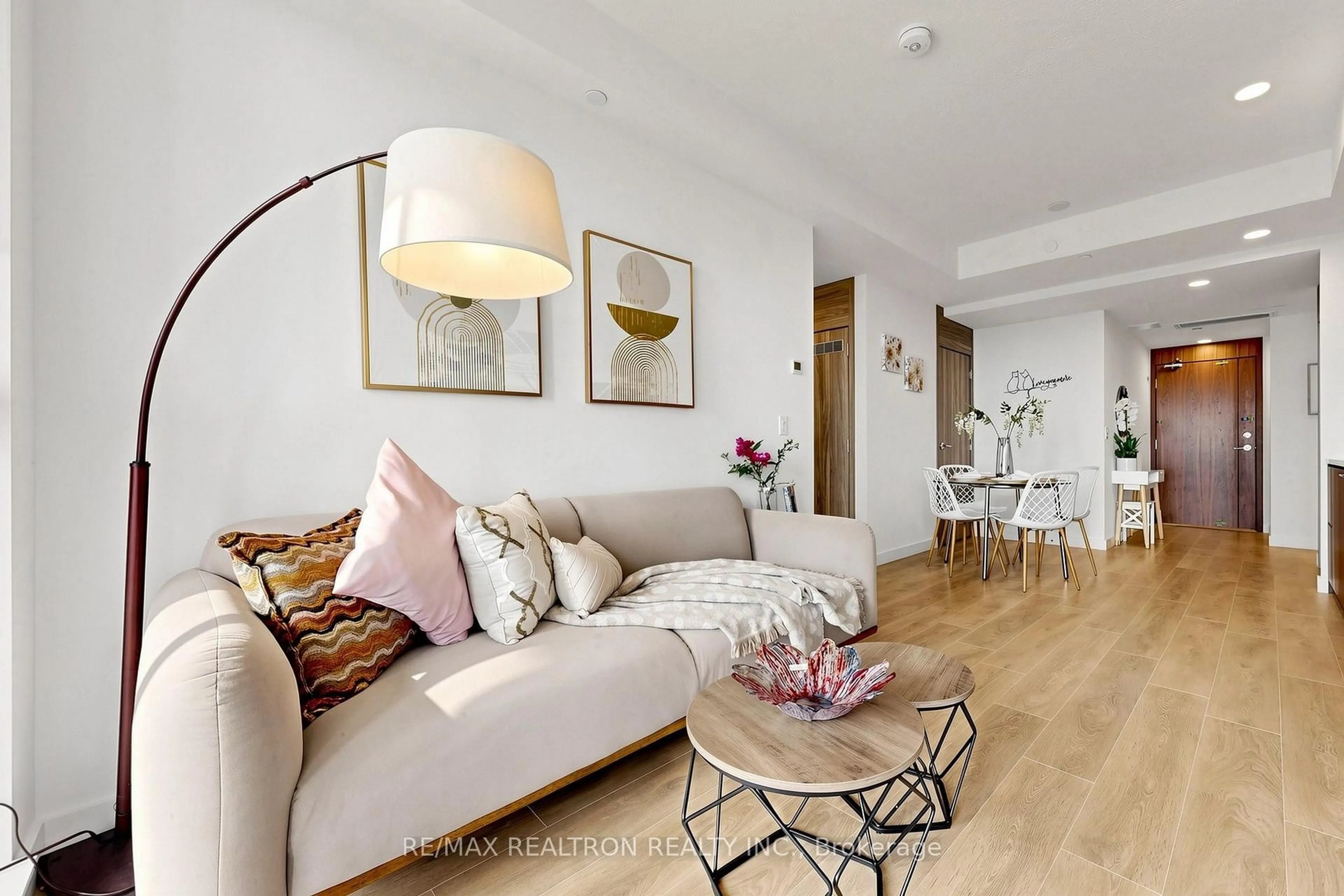 Living room with furniture, wood/laminate floor for 68 Esther Shiner Blvd #1102, Toronto Ontario M2K 0J6