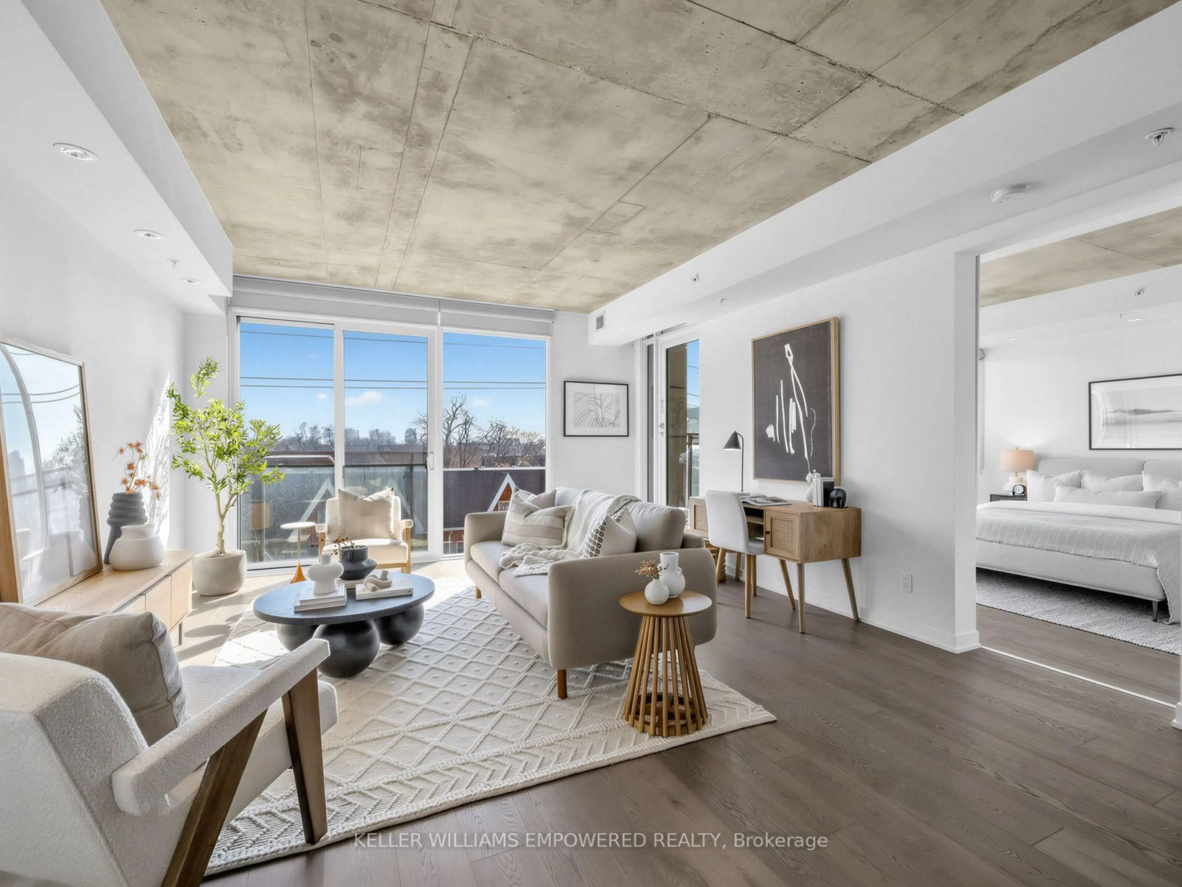 Living room with furniture, cement floor for 130 Rusholme Rd #406, Toronto Ontario M6H 1A7