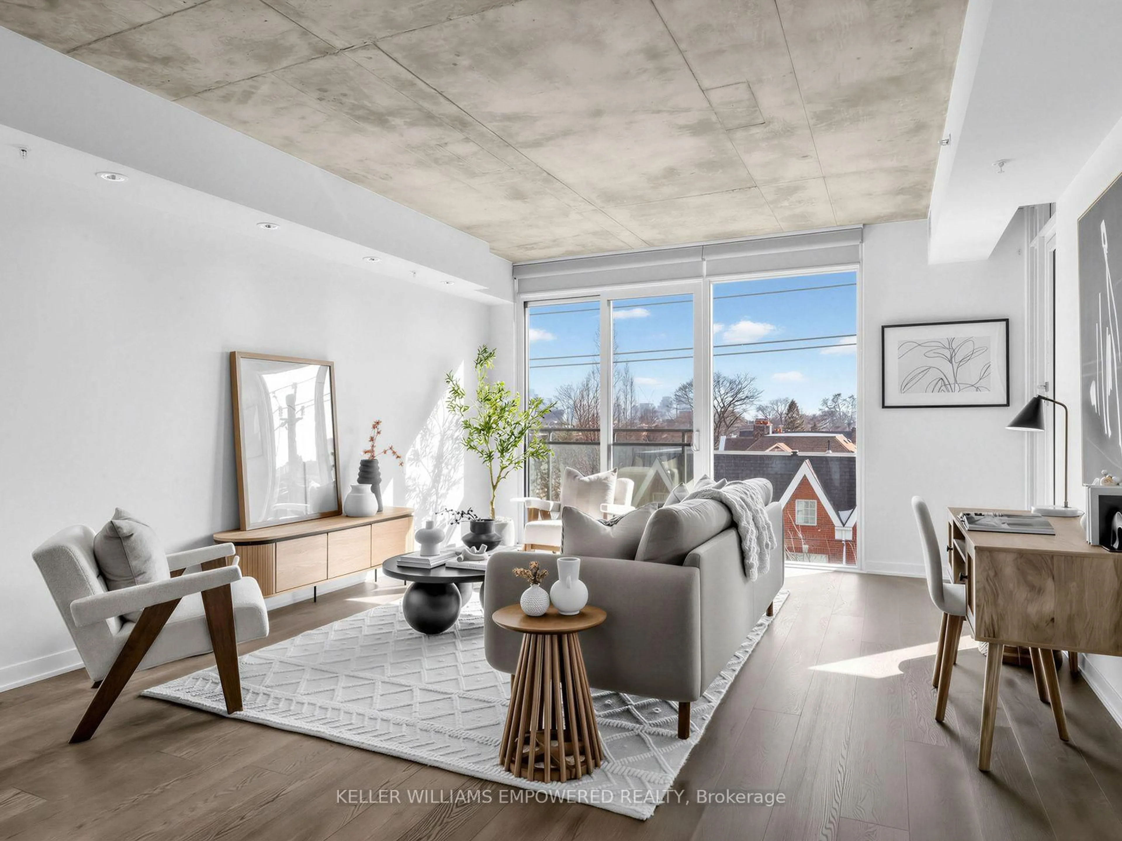 Living room with furniture, cement floor for 130 Rusholme Rd #406, Toronto Ontario M6H 1A7