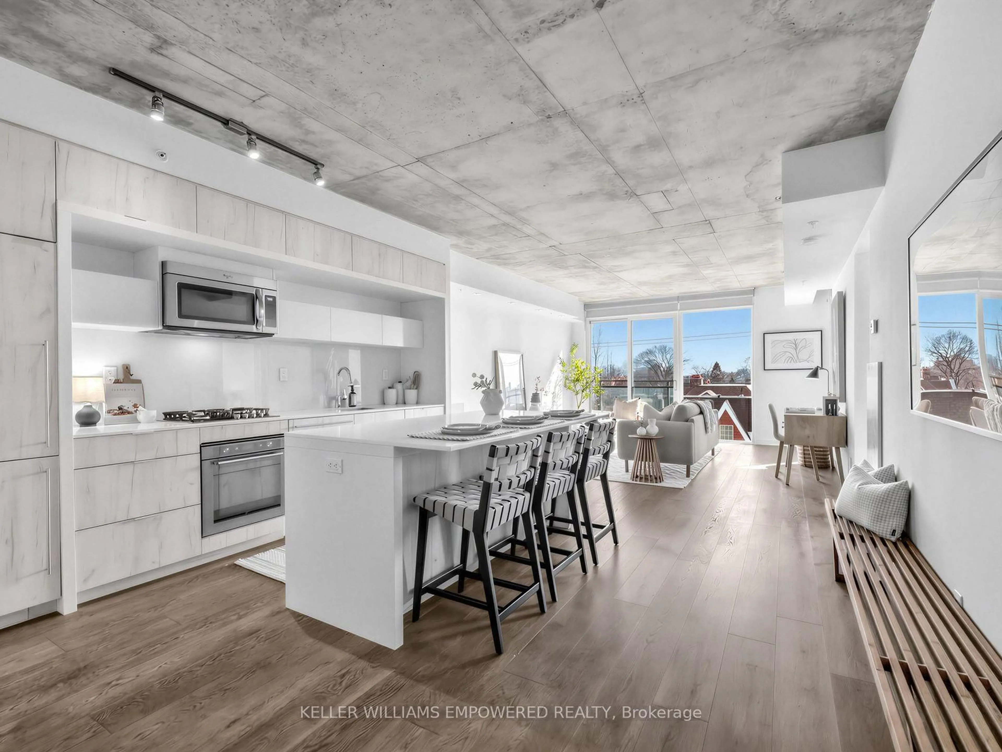 Open concept kitchen, cement floor for 130 Rusholme Rd #406, Toronto Ontario M6H 1A7
