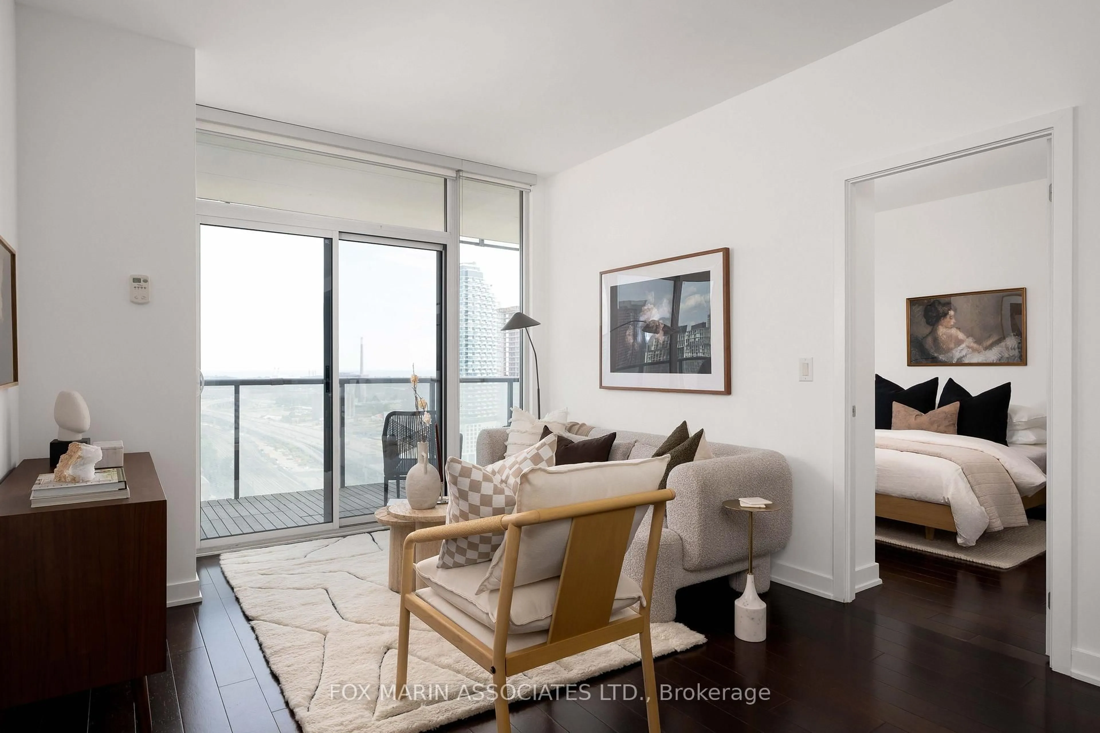 Living room with furniture, wood/laminate floor for 1 Market St #2405, Toronto Ontario M5E 0A2