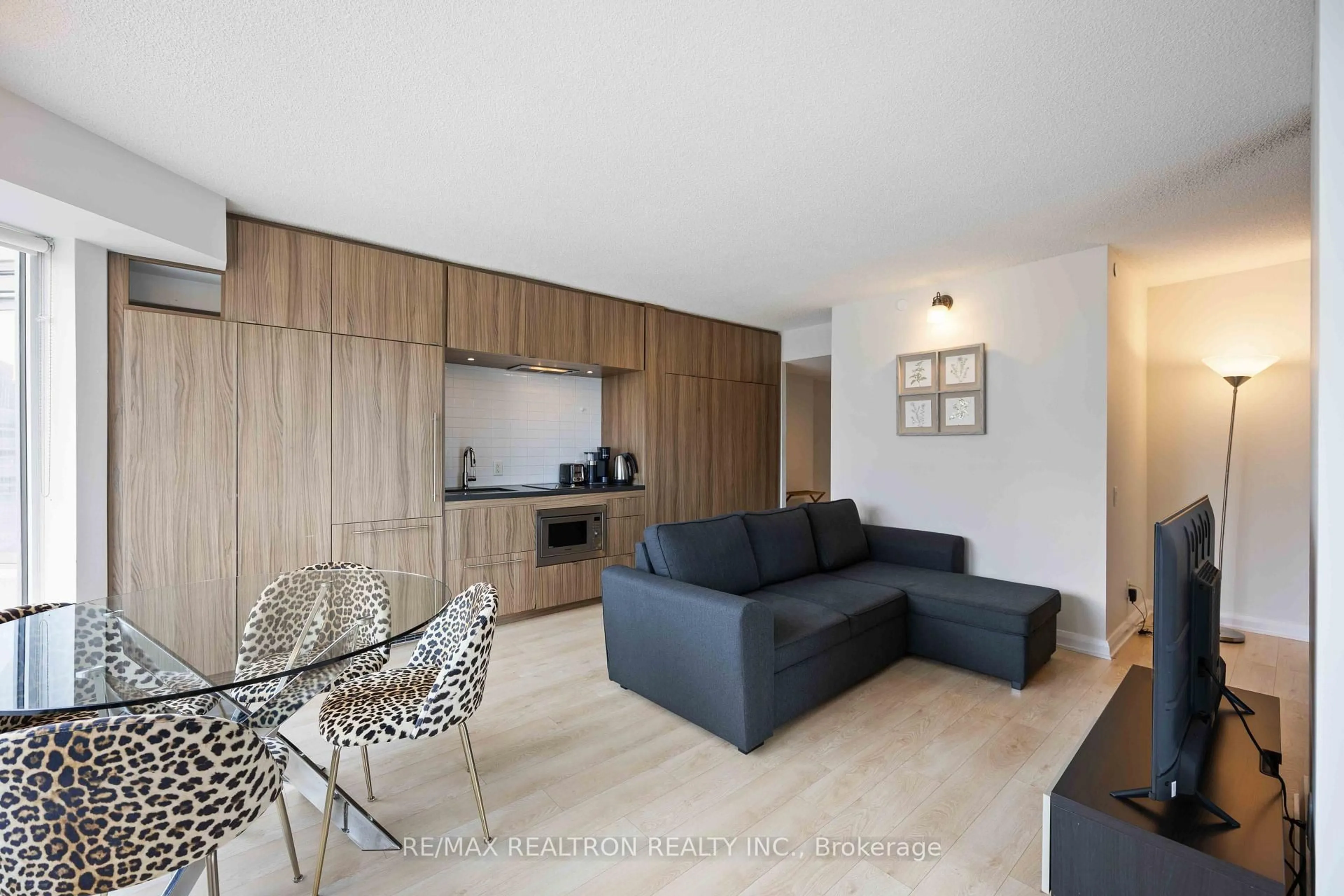 Living room with furniture, wood/laminate floor for 155 Yorkville Ave #2604, Toronto Ontario M5R 0B4