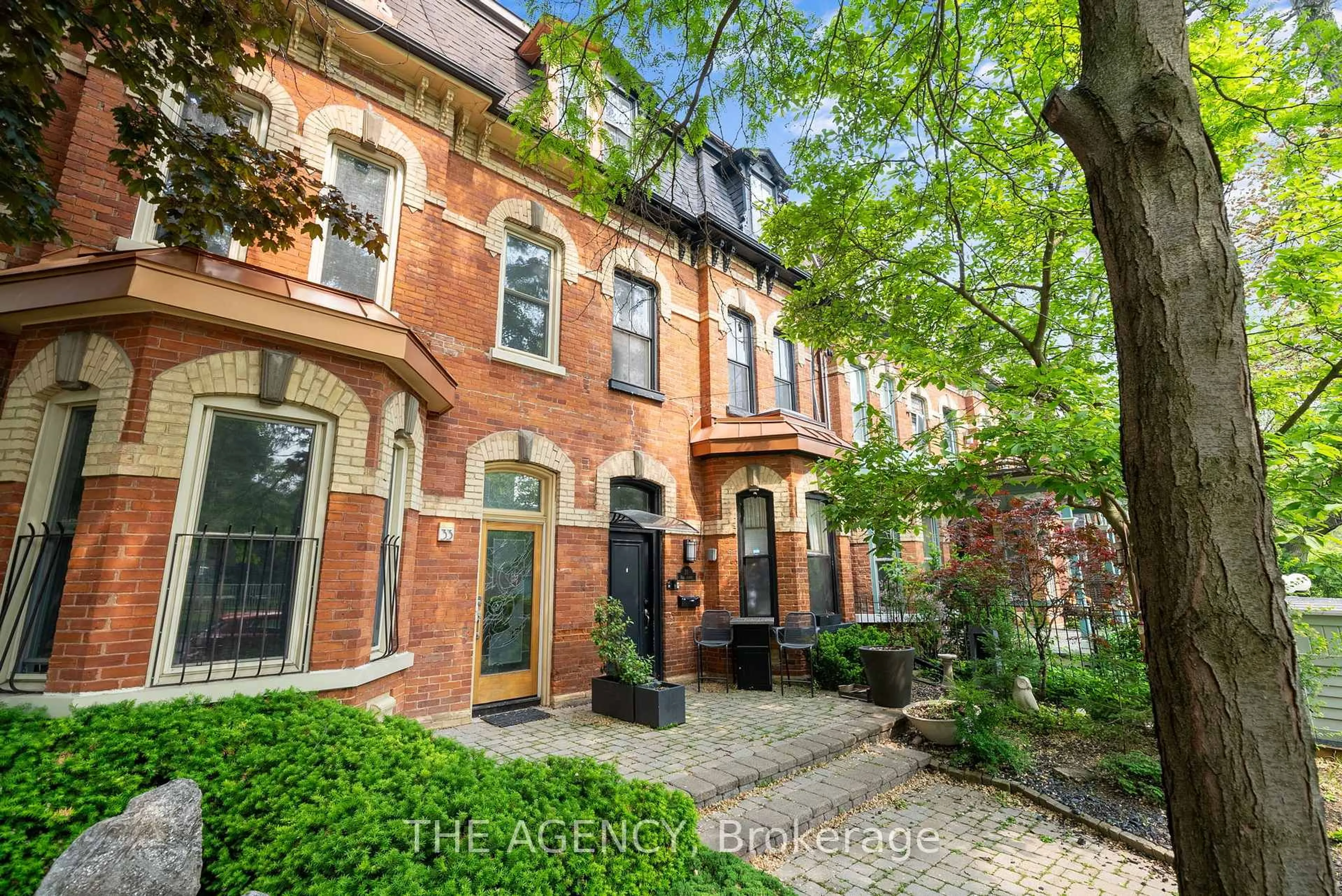 Home with brick exterior material, street for 31 Rose Ave, Toronto Ontario M4X 1N7