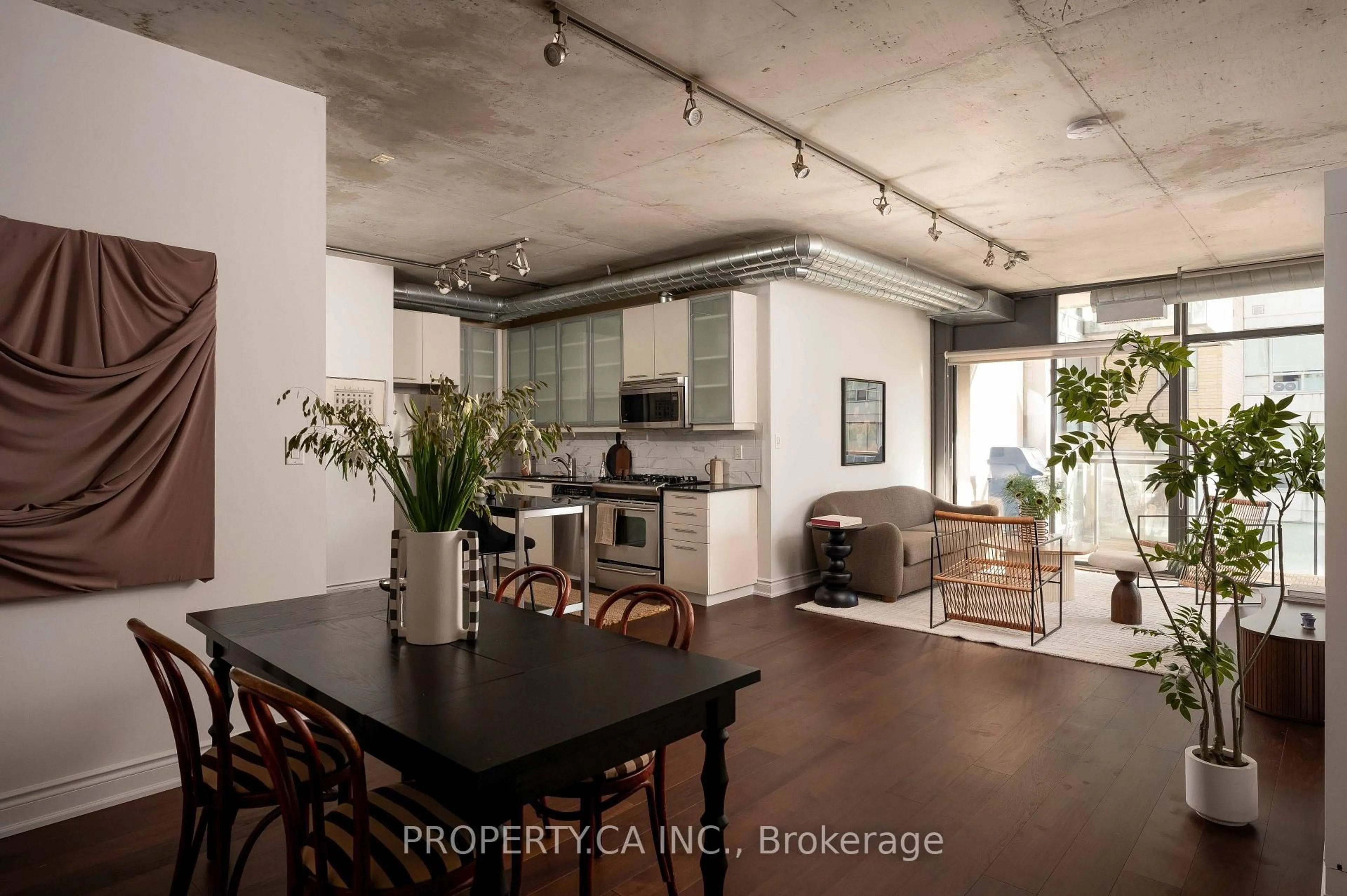 Open concept kitchen, cement floor for 533 Richmond St #605, Toronto Ontario M5V 3Y1