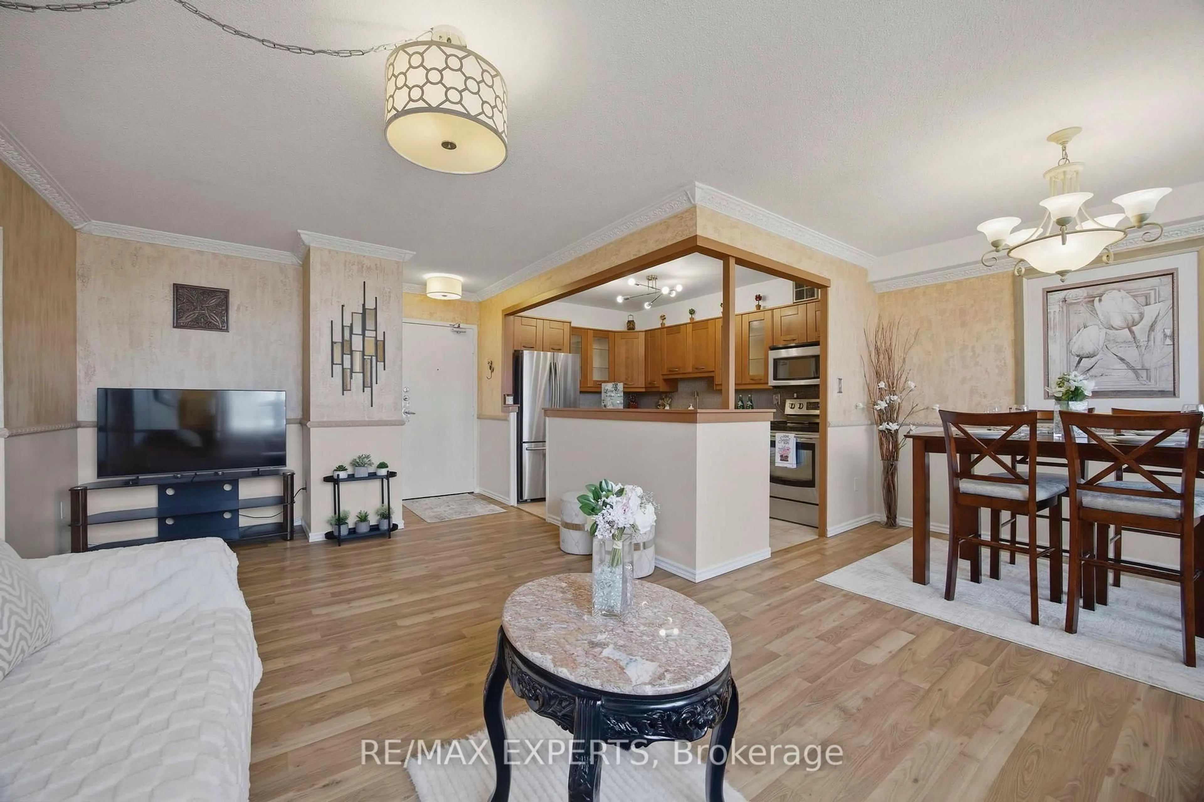 Living room with furniture, wood/laminate floor for 5 Shady Gfwy #1417, Toronto Ontario M3C 3A5