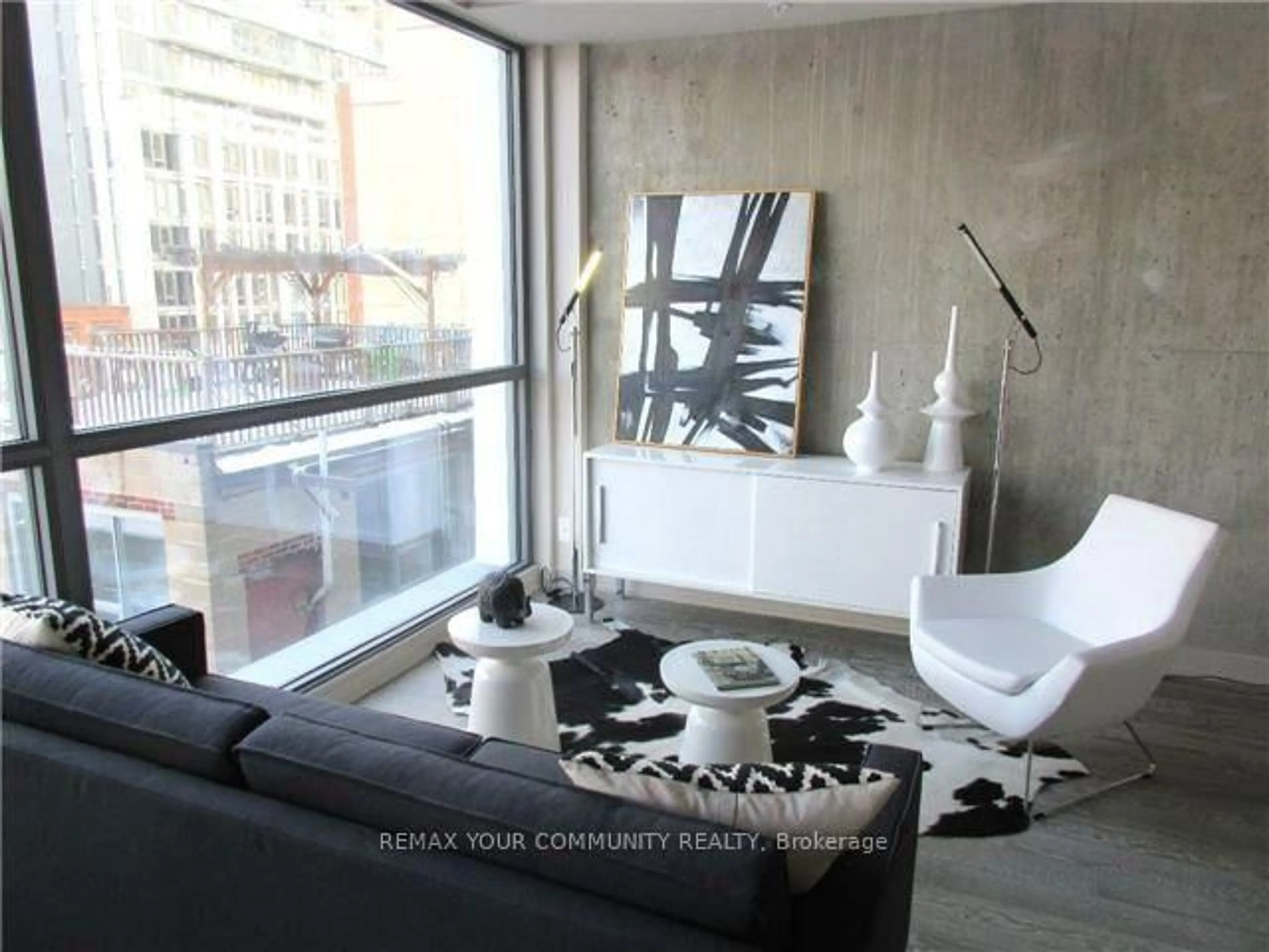 Living room with furniture, cement floor for 39 Brant St #401, Toronto Ontario M5V 2L9