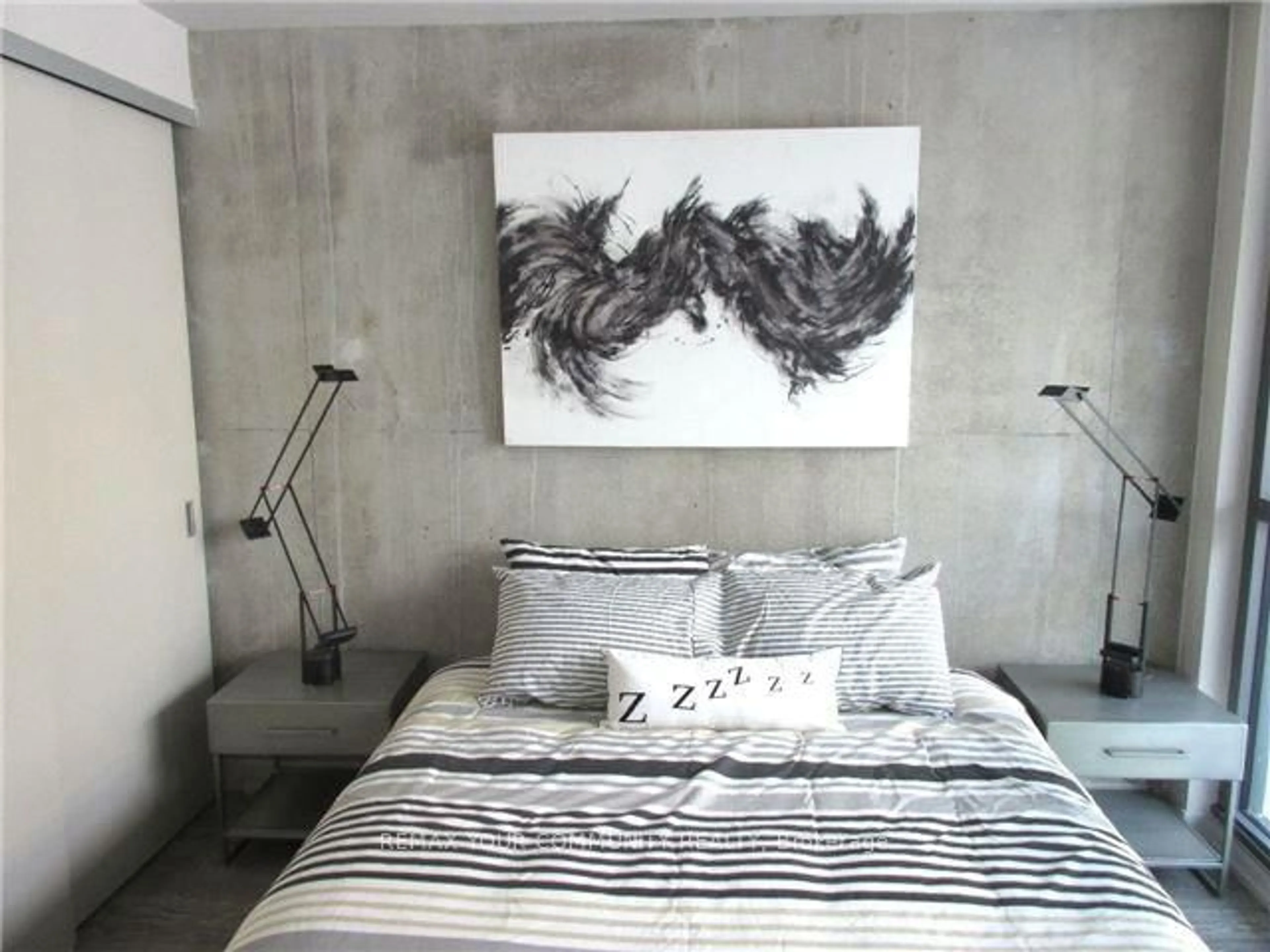 Bedroom with bed, cement floor for 39 Brant St #401, Toronto Ontario M5V 2L9