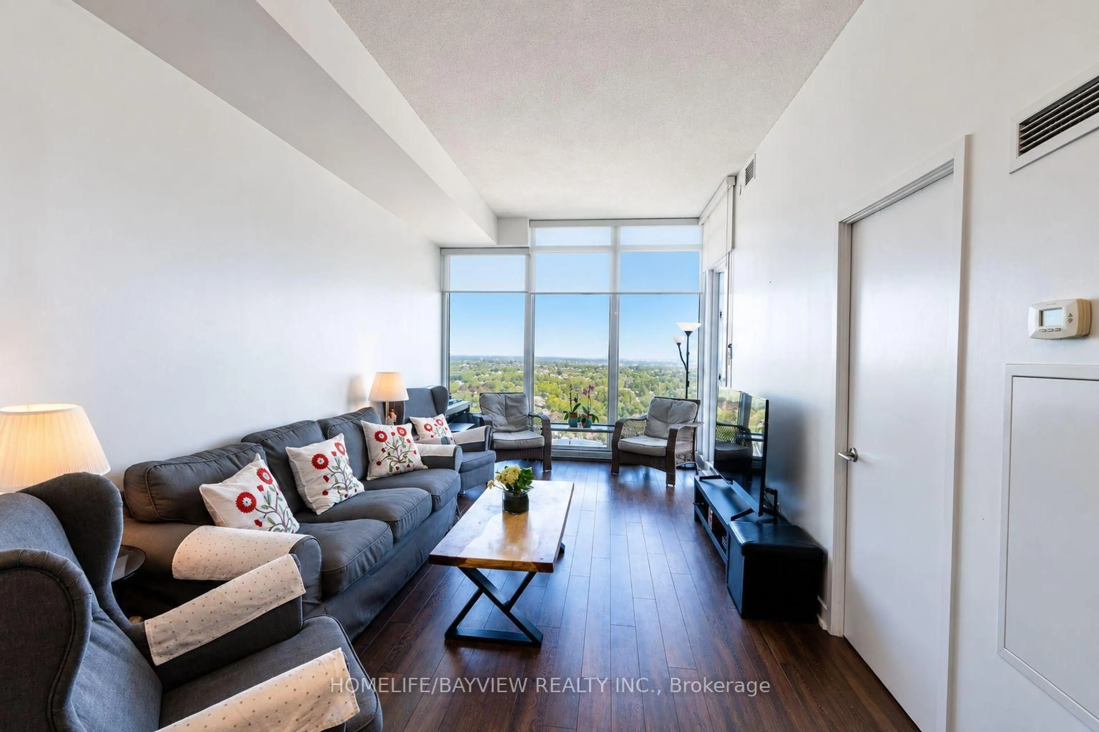 Living room with furniture, wood/laminate floor for 72 Esther Shiner Blvd #2309, Toronto Ontario M2K 0C4