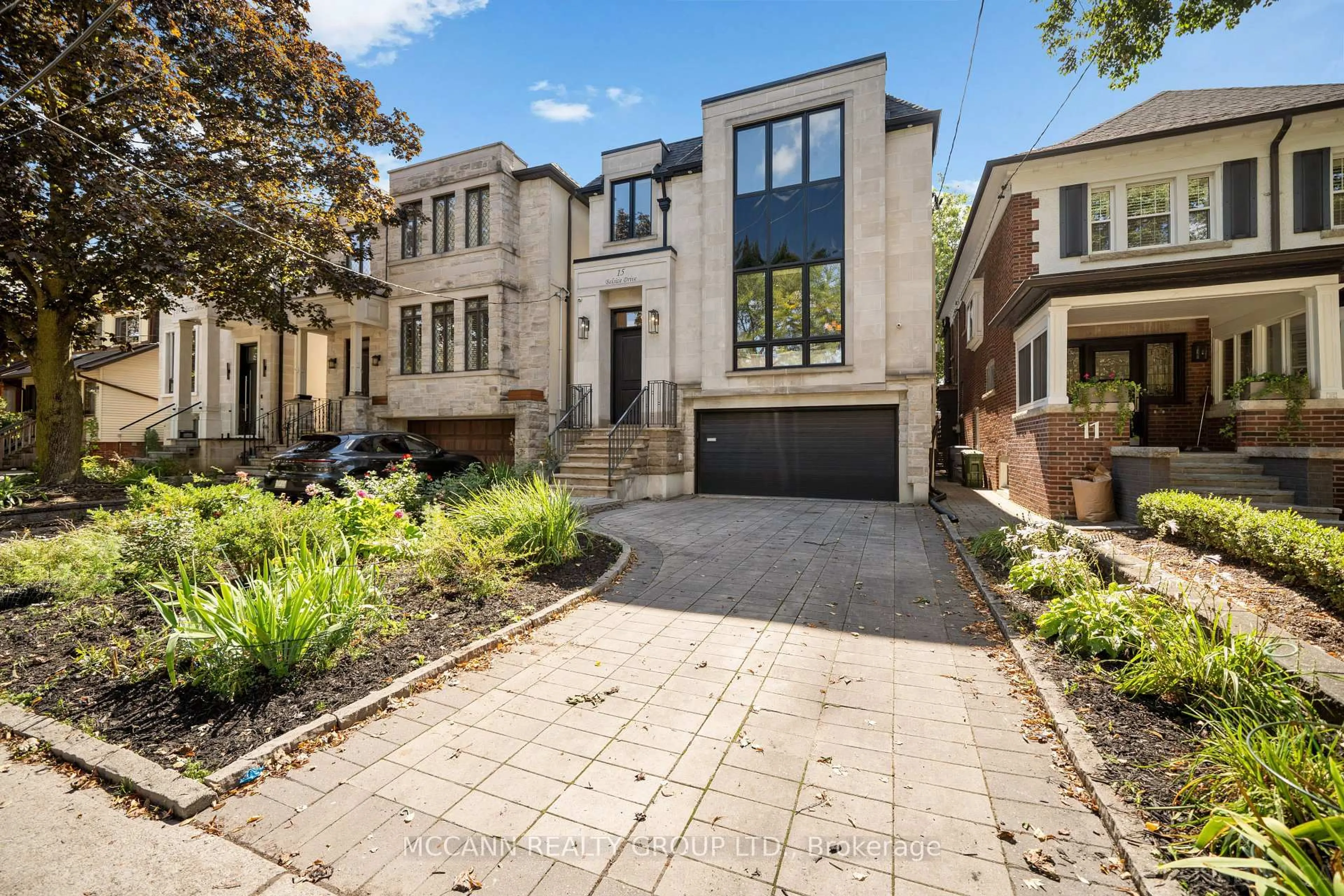 Home with brick exterior material, street for 15 Belsize Dr, Toronto Ontario M4S 1L3