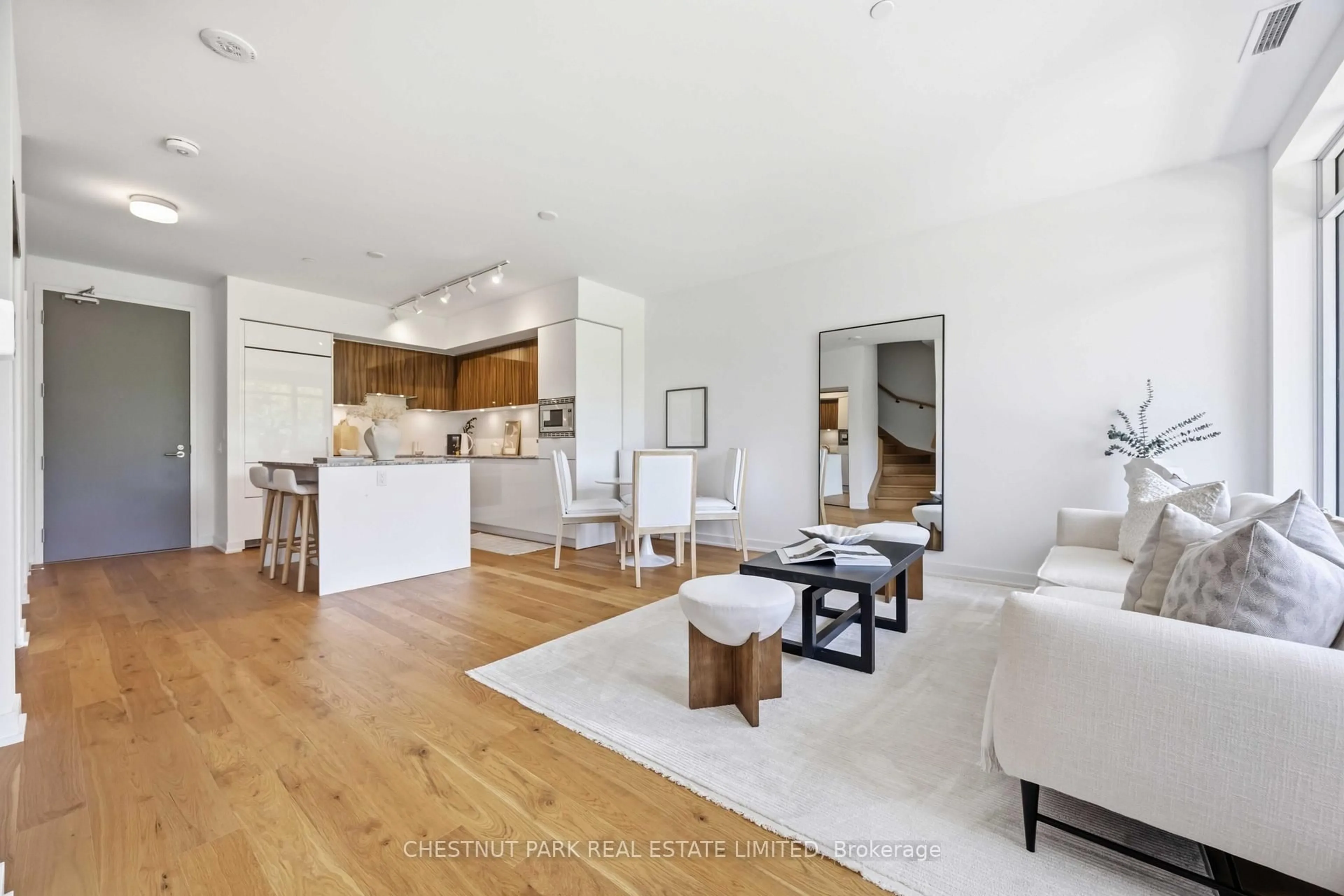 Open concept kitchen, wood/laminate floor for 20 O'Neill Rd #TH107, Toronto Ontario M3C 0R2
