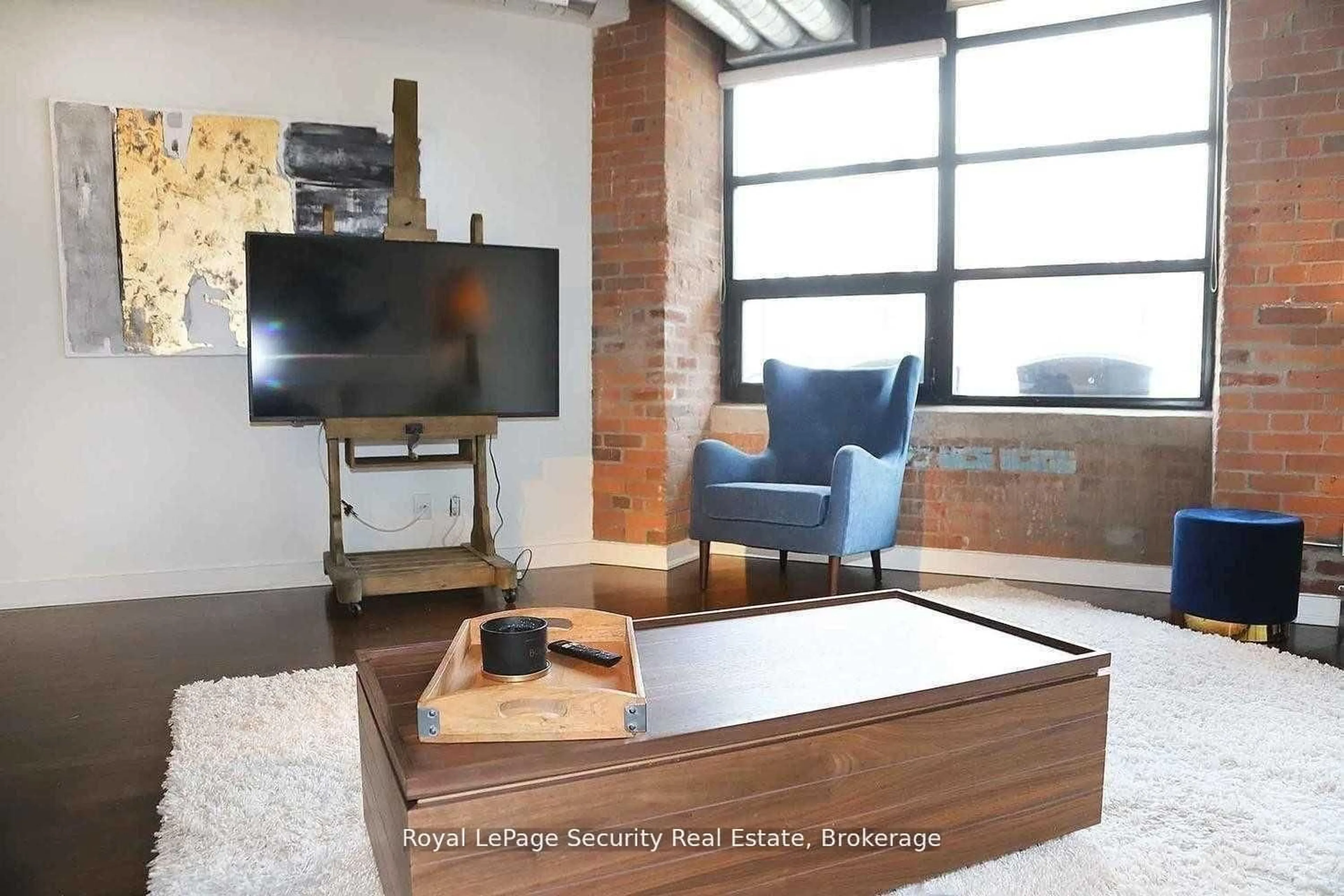 Living room with furniture, unknown for 43 Hanna Ave #208, Toronto Ontario M6K 1X1